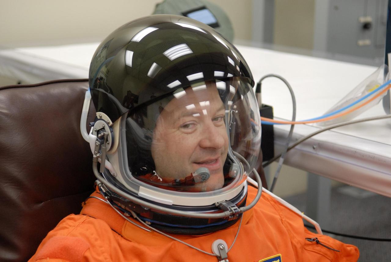 KENNEDY SPACE CENTER, FLA. -- The crew members of mission STS-116 are suiting up for launch at 9:35 p.m. EST from Launch Pad 39B aboard Space Shuttle Discovery. Pictured here is Mission Specialist Nicholas Patrick, who will be making his first shuttle flight. This is Discovery's 33rd mission and the first night launch since 2003. The 20th shuttle mission to the International Space Station, STS-116 carries another truss segment, P5. It will serve as a spacer, mated to the P4 truss that was attached in September. After installing the P5, the crew will reconfigure and redistribute the power generated by two pairs of U.S. solar arrays. Landing is expected Dec. 19 at KSC. Photo credit: NASA/Kim Shiflett