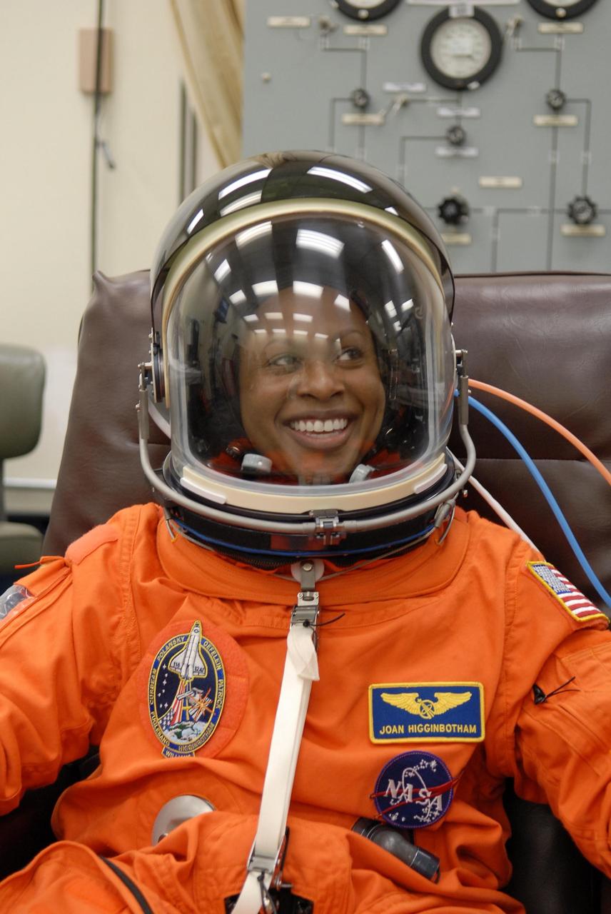 KENNEDY SPACE CENTER, FLA. -- The crew members of mission STS-116 are suiting up for launch at 9:35 p.m. EST from Launch Pad 39B aboard Space Shuttle Discovery. Pictured here is Mission Specialist Joan Higginbotham, who will be making her first shuttle flight This is Discovery's 33rd mission and the first night launch since 2003. The 20th shuttle mission to the International Space Station, STS-116 carries another truss segment, P5. It will serve as a spacer, mated to the P4 truss that was attached in September. After installing the P5, the crew will reconfigure and redistribute the power generated by two pairs of U.S. solar arrays. Landing is expected Dec. 19 at KSC. Photo credit: NASA/Kim Shiflett