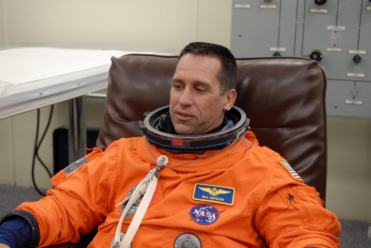 KENNEDY SPACE CENTER, FLA. --  The crew members of mission STS-116 are suiting up for launch at 9:35 p.m. EST from Launch Pad 39B aboard Space Shuttle Discovery.  Pictured here is Pilot William Oefelein, who will be making his first shuttle flight.  This is Discovery's 33rd mission and the first night launch since 2003.   The 20th shuttle mission to the International Space Station, STS-116 carries another truss segment, P5. It will serve as a spacer, mated to the P4 truss that was attached in September.  After installing the P5, the crew will reconfigure and redistribute the power generated by two pairs of U.S. solar arrays. Landing is expected Dec. 19 at KSC.   Photo credit: NASA/Kim Shiflett