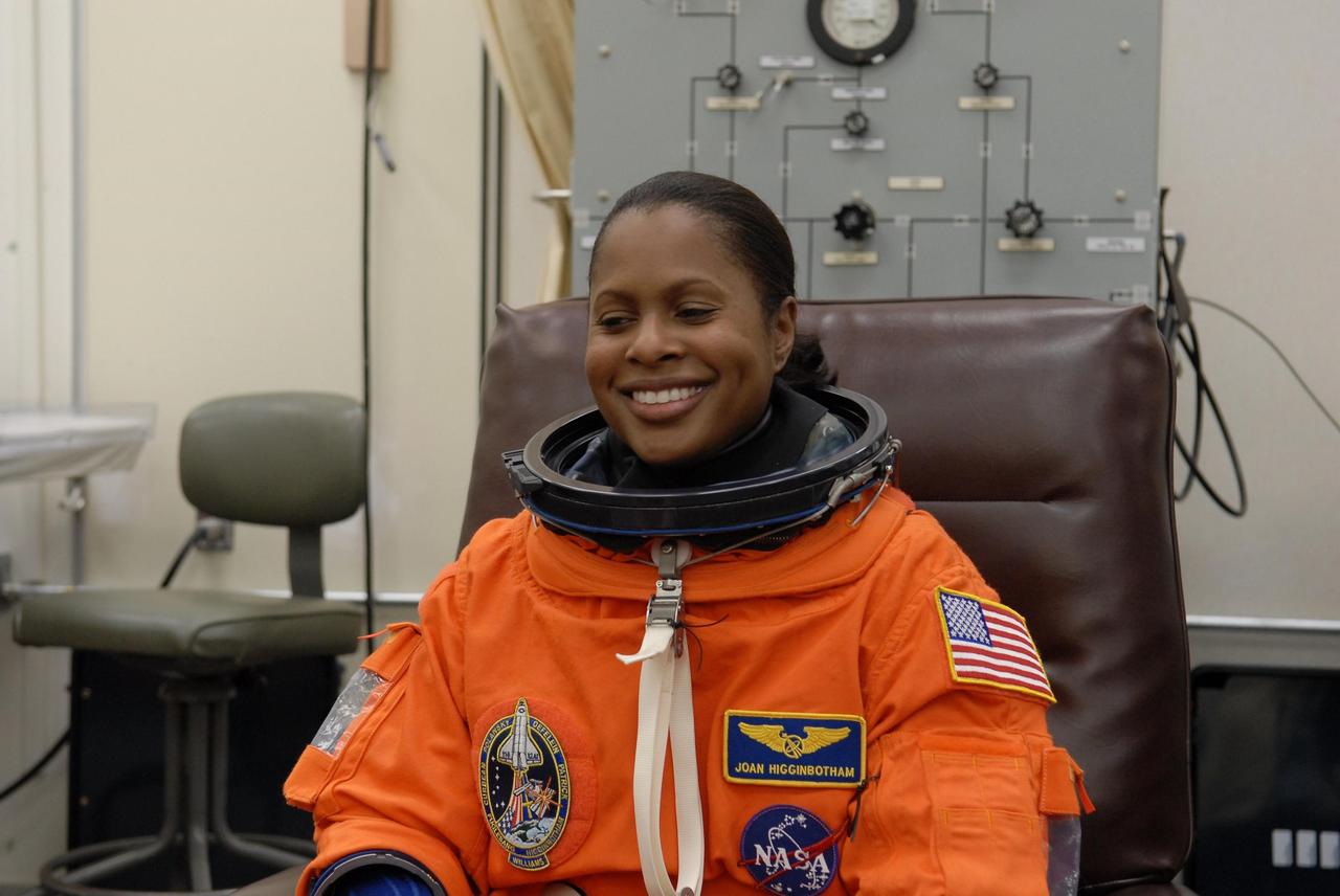KENNEDY SPACE CENTER, FLA. --   The crew members of mission STS-116 are suiting up for a second launch attempt at 8:47 p.m. EST from Launch Pad 39B aboard Space Shuttle Discovery.   Pictured here is Mission Specialist Joan Higginbotham, who will be making her first shuttle flight. The first launch attempt of STS-116 on Dec. 7 was postponed due a low cloud ceiling over Kennedy Space Center. This is Discovery's 33rd mission and the first night launch since 2002.   The 20th shuttle mission to the International Space Station, STS-116 carries another truss segment, P5. It will serve as a spacer, mated to the P4 truss that was attached in September.  After installing the P5, the crew will reconfigure and redistribute the power generated by two pairs of U.S. solar arrays. Landing is expected Dec. 19 at KSC.   Photo credit: NASA/Kim Shiflett