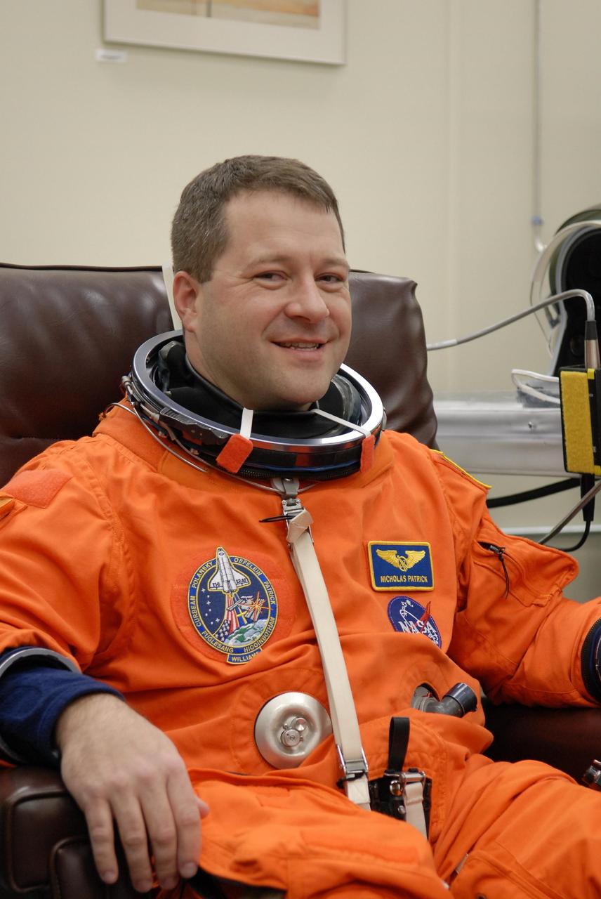 KENNEDY SPACE CENTER, FLA. -- The crew members of mission STS-116 are suiting up for a second launch attempt at 8:47 p.m. EST from Launch Pad 39B aboard Space Shuttle Discovery. Pictured here is Mission Specialist Nicholas Patrick, who will be making his first shuttle flight. The first launch attempt of STS-116 on Dec. 7 was postponed due a low cloud ceiling over Kennedy Space Center. This is Discovery's 33rd mission and the first night launch since 2002. The 20th shuttle mission to the International Space Station, STS-116 carries another truss segment, P5. It will serve as a spacer, mated to the P4 truss that was attached in September. After installing the P5, the crew will reconfigure and redistribute the power generated by two pairs of U.S. solar arrays. Landing is expected Dec. 19 at KSC. Photo credit: NASA/Kim Shiflett