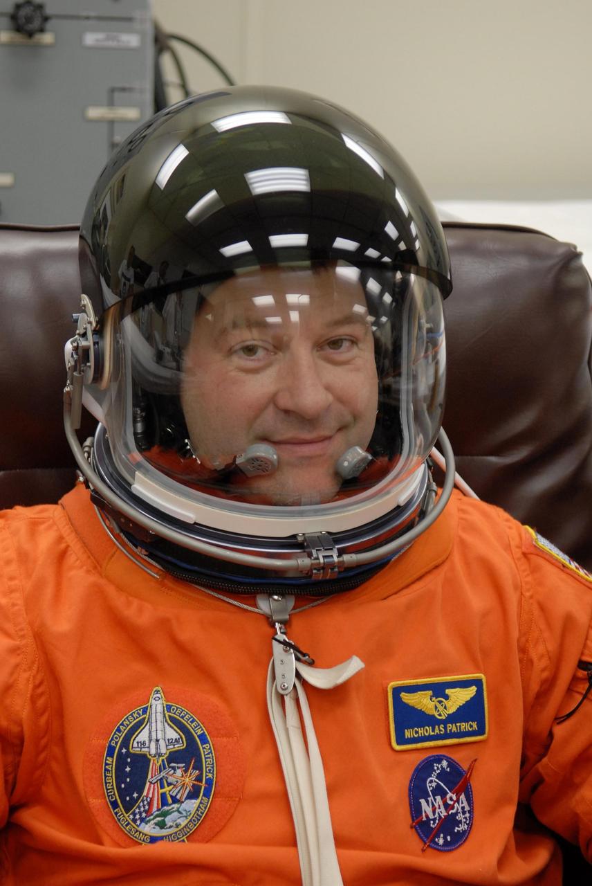 KENNEDY SPACE CENTER, FLA. --   The crew members of mission STS-116 are suiting up for a second launch attempt at 8:47 p.m. EST from Launch Pad 39B aboard Space Shuttle Discovery.  Pictured here,  Mission Specialist Nicholas Patrick is ready after donning his helmet.  Patrick will be making his first shuttle flight.  The first launch attempt of STS-116 on Dec. 7 was postponed due a low cloud ceiling over Kennedy Space Center. This is Discovery's 33rd mission and the first night launch since 2002.   The 20th shuttle mission to the International Space Station, STS-116 carries another truss segment, P5. It will serve as a spacer, mated to the P4 truss that was attached in September.  After installing the P5, the crew will reconfigure and redistribute the power generated by two pairs of U.S. solar arrays. Landing is expected Dec. 19 at KSC.   Photo credit: NASA/Kim Shiflett
