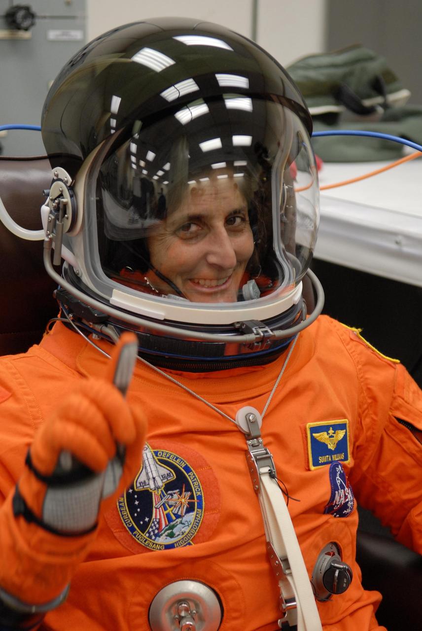 KENNEDY SPACE CENTER, FLA. --   The crew members of mission STS-116 are suiting up for a second launch attempt at 8:47 p.m. EST from Launch Pad 39B aboard Space Shuttle Discovery.  Pictured here is Sunita Williams, who will be making her first shuttle flight.  Williams will replace International Space Station Expedition 14 crew member Thomas Reiter, who will return to Earth aboard Discovery in her place.  The first launch attempt of STS-116 on Dec. 7 was postponed due a low cloud ceiling over Kennedy Space Center. This is Discovery's 33rd mission and the first night launch since 2002.   The 20th shuttle mission to the International Space Station, STS-116 carries another truss segment, P5. It will serve as a spacer, mated to the P4 truss that was attached in September.  After installing the P5, the crew will reconfigure and redistribute the power generated by two pairs of U.S. solar arrays. Landing is expected Dec. 19 at KSC.   Photo credit: NASA/Kim Shiflett