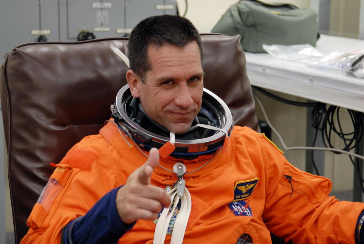 KENNEDY SPACE CENTER, FLA. --   The crew members of mission STS-116 are suiting up for a second launch attempt at 8:47 p.m. EST from Launch Pad 39B aboard Space Shuttle Discovery.   Pictured here is Pilot William Oefelein, who will be making his first shuttle flight.  The first launch attempt of STS-116 on Dec. 7 was postponed due a low cloud ceiling over Kennedy Space Center. This is Discovery's 33rd mission and the first night launch since 2002.   The 20th shuttle mission to the International Space Station, STS-116 carries another truss segment, P5. It will serve as a spacer, mated to the P4 truss that was attached in September.  After installing the P5, the crew will reconfigure and redistribute the power generated by two pairs of U.S. solar arrays. Landing is expected Dec. 19 at KSC.   Photo credit: NASA/Kim Shiflett