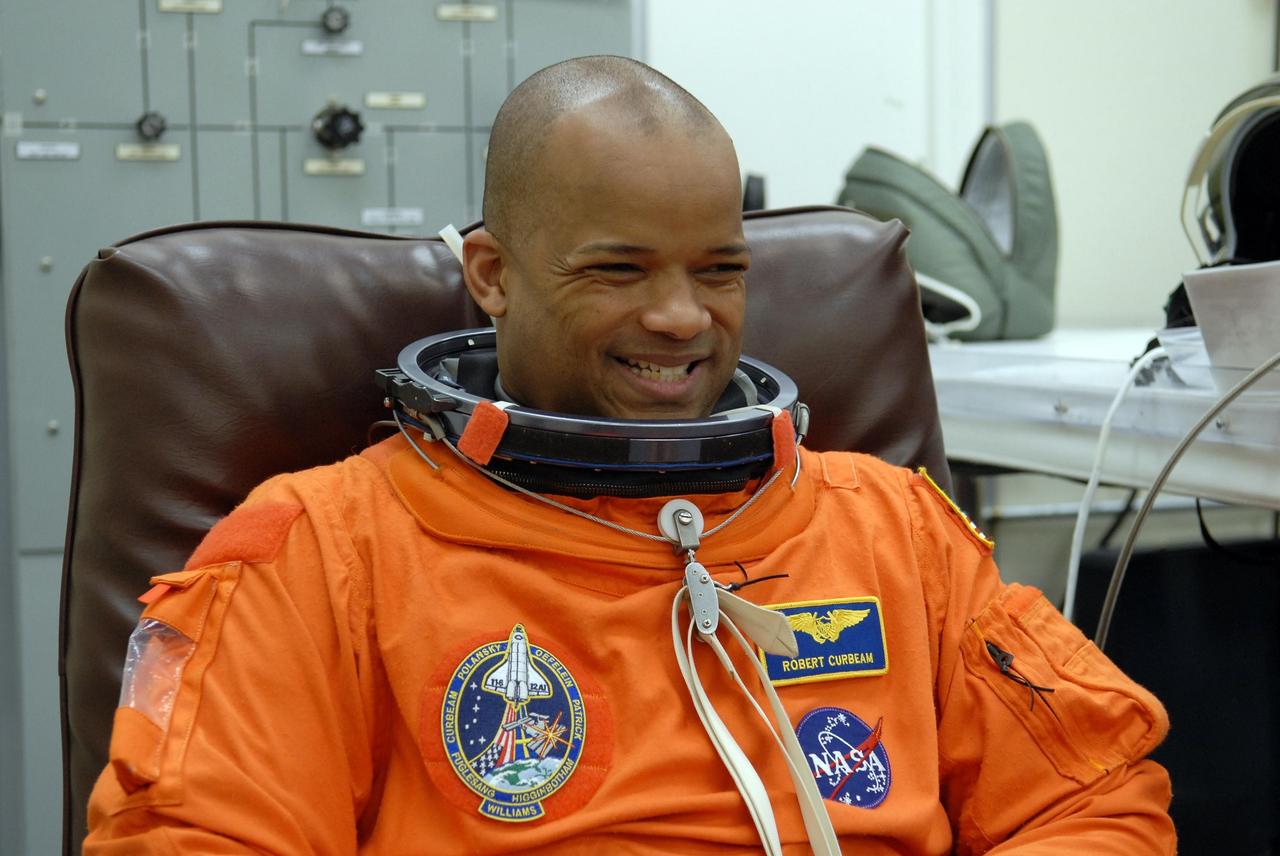 KENNEDY SPACE CENTER, FLA. --   The crew members of mission STS-116 are suiting up for a second launch attempt at 8:47 p.m. EST from Launch Pad 39B aboard Space Shuttle Discovery.    Pictured here is Mission Specialist Robert Curbeam, who is making his third shuttle flight. The first launch attempt of STS-116 on Dec. 7 was postponed due a low cloud ceiling over Kennedy Space Center. This is Discovery's 33rd mission and the first night launch since 2002.   The 20th shuttle mission to the International Space Station, STS-116 carries another truss segment, P5. It will serve as a spacer, mated to the P4 truss that was attached in September.  After installing the P5, the crew will reconfigure and redistribute the power generated by two pairs of U.S. solar arrays. Landing is expected Dec. 19 at KSC.   Photo credit: NASA/Kim Shiflett