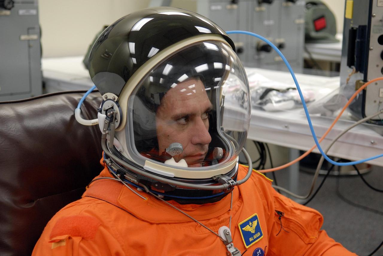 KENNEDY SPACE CENTER, FLA. --   The crew members of mission STS-116 are suiting up for a second launch attempt at 8:47 p.m. EST from Launch Pad 39B aboard Space Shuttle Discovery.  Pictured here is Pilot William Oefelein, who is making his first shuttle flight. The first launch attempt of STS-116 on Dec. 7 was postponed due a low cloud ceiling over Kennedy Space Center. This is Discovery's 33rd mission and the first night launch since 2002.   The 20th shuttle mission to the International Space Station, STS-116 carries another truss segment, P5. It will serve as a spacer, mated to the P4 truss that was attached in September.  After installing the P5, the crew will reconfigure and redistribute the power generated by two pairs of U.S. solar arrays. Landing is expected Dec. 19 at KSC.   Photo credit: NASA/Kim Shiflett