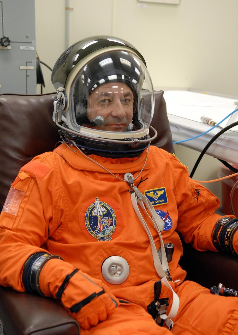 KENNEDY SPACE CENTER, FLA. --   The crew members of mission STS-116 are suiting up for a second launch attempt at 8:47 p.m. EST from Launch Pad 39B aboard Space Shuttle Discovery.  Polansky is making his second shuttle flight. The first launch attempt of STS-116 on Dec. 7 was postponed due a low cloud ceiling over Kennedy Space Center. This is Discovery's 33rd mission and the first night launch since 2002.   The 20th shuttle mission to the International Space Station, STS-116 carries another truss segment, P5. It will serve as a spacer, mated to the P4 truss that was attached in September.  After installing the P5, the crew will reconfigure and redistribute the power generated by two pairs of U.S. solar arrays. Landing is expected Dec. 19 at KSC.   Photo credit: NASA/Kim Shiflett