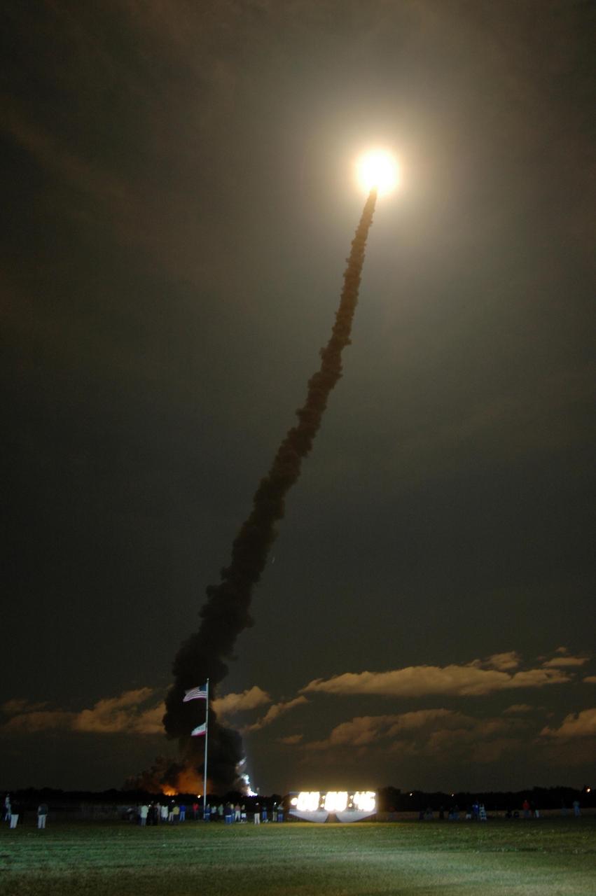KENNEDY SPACE CENTER, FLA. --   Like a shooting star flooding the night sky with its blazing light, Space Shuttle Discovery leaps toward the sky from Launch Pad 39B on mission STS-116.  The launch occurred at 8:47:35 p.m. EST.  This was the second launch attempt for mission STS-116.  The first launch attempt on Dec. 7 was postponed due a low cloud ceiling over Kennedy Space Center. This is Discovery's 33rd mission and the first night launch since 2002.   The 20th shuttle mission to the International Space Station, STS-116 carries another truss segment, P5. It will serve as a spacer, mated to the P4 truss that was attached in September.  After installing the P5, the crew will reconfigure and redistribute the power generated by two pairs of U.S. solar arrays. Landing is expected Dec. 21 at KSC.   Photo credit: NASA/Jim Grossmann