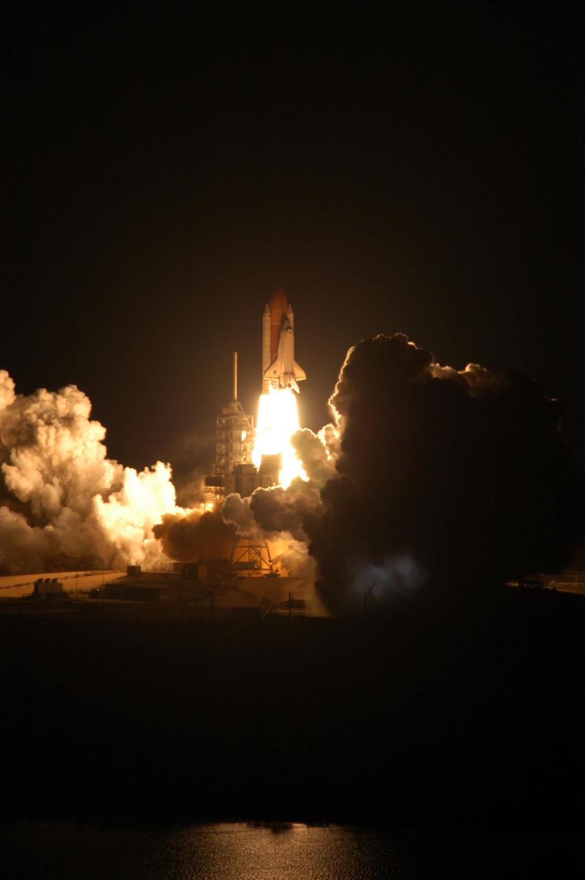 KENNEDY SPACE CENTER, FLA. --   Flooding the night sky with its blazing light, Space Shuttle Discovery leaps toward the sky from Launch Pad 39B on mission STS-116. The launch occurred at 8:47:35 p.m. EST.  This was the second launch attempt for mission STS-116.  The first launch attempt on Dec. 7 was postponed due a low cloud ceiling over Kennedy Space Center. This is Discovery's 33rd mission and the first night launch since 2002.   The 20th shuttle mission to the International Space Station, STS-116 carries another truss segment, P5. It will serve as a spacer, mated to the P4 truss that was attached in September.  After installing the P5, the crew will reconfigure and redistribute the power generated by two pairs of U.S. solar arrays. Landing is expected Dec. 21 at KSC.   Photo credit: NASA/George Shelton
