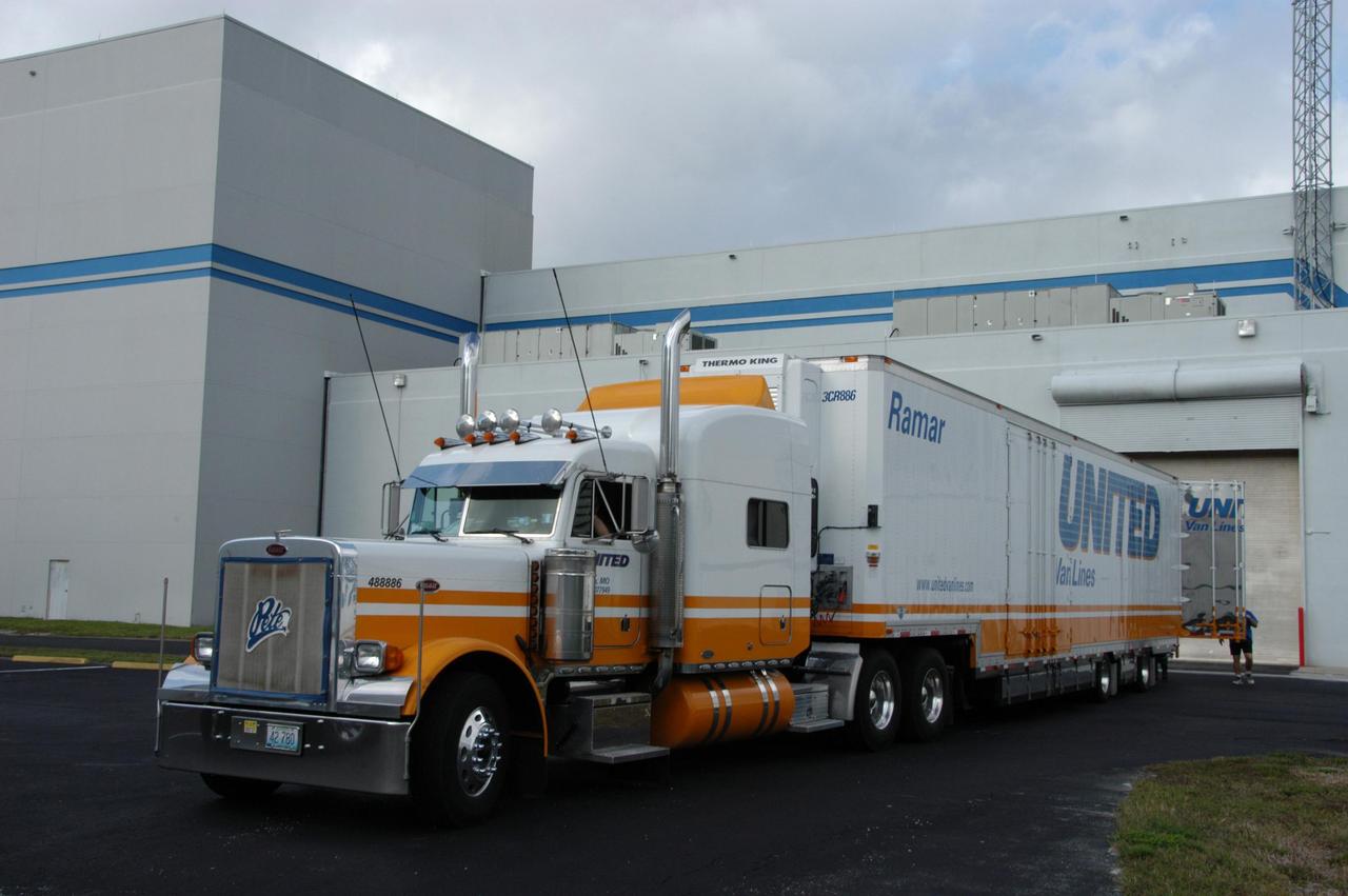 KENNEDY SPACE CENTER, FLA. --   The truck carrying the THEMIS spacecraft arrives at  Astrotech Space Operations in Titusville, Fla.  THEMIS, which stands for Time History of Events and Macroscale Interactions during Substorms, comprises five identical probes that will study the dynamic and colorful eruptions of auroras. THEMIS is scheduled to  launch Feb. 15 from Cape Canaveral Air Force Station.  Photo credit: NASA/George Shelton