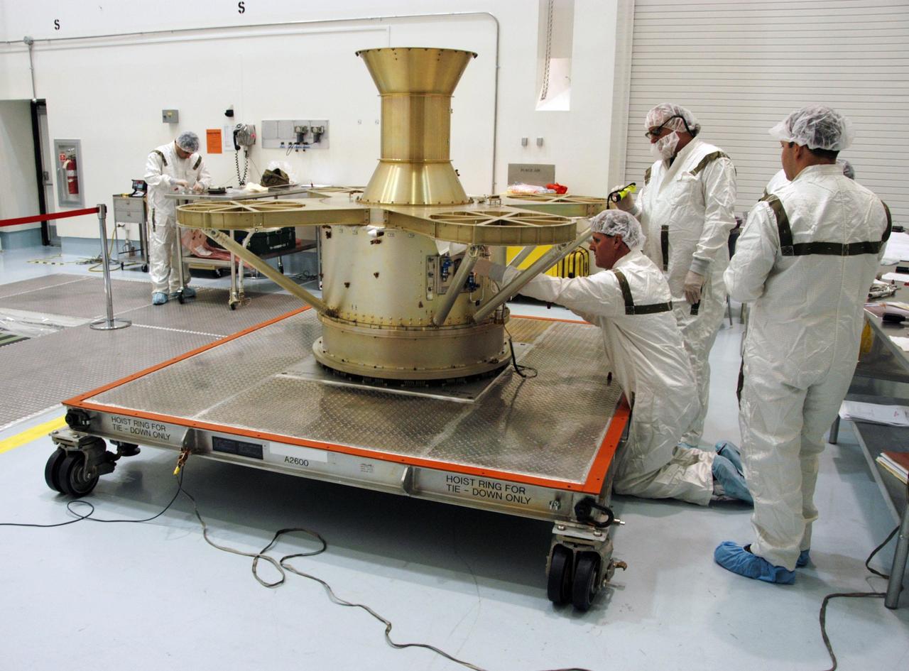 KENNEDY SPACE CENTER, FLA. -- At Astrotech Space Operations in Titusville, Fla., a worker attaches a high pressure line on the THEMIS spacecraft in preparation for fueling, which is scheduled for Jan. 3-5. THEMIS consists of five identical probes, the largest number of scientific satellites ever launched into orbit aboard a single rocket. This unique constellation of satellites will resolve the tantalizing mystery of what causes the spectacular sudden brightening of the aurora borealis and aurora australis - the fiery skies over the Earth's northern and southern polar regions. THEMIS is scheduled to launch Feb. 15 from Cape Canaveral Air Force Station. Photo credit: NASA/George Shelton