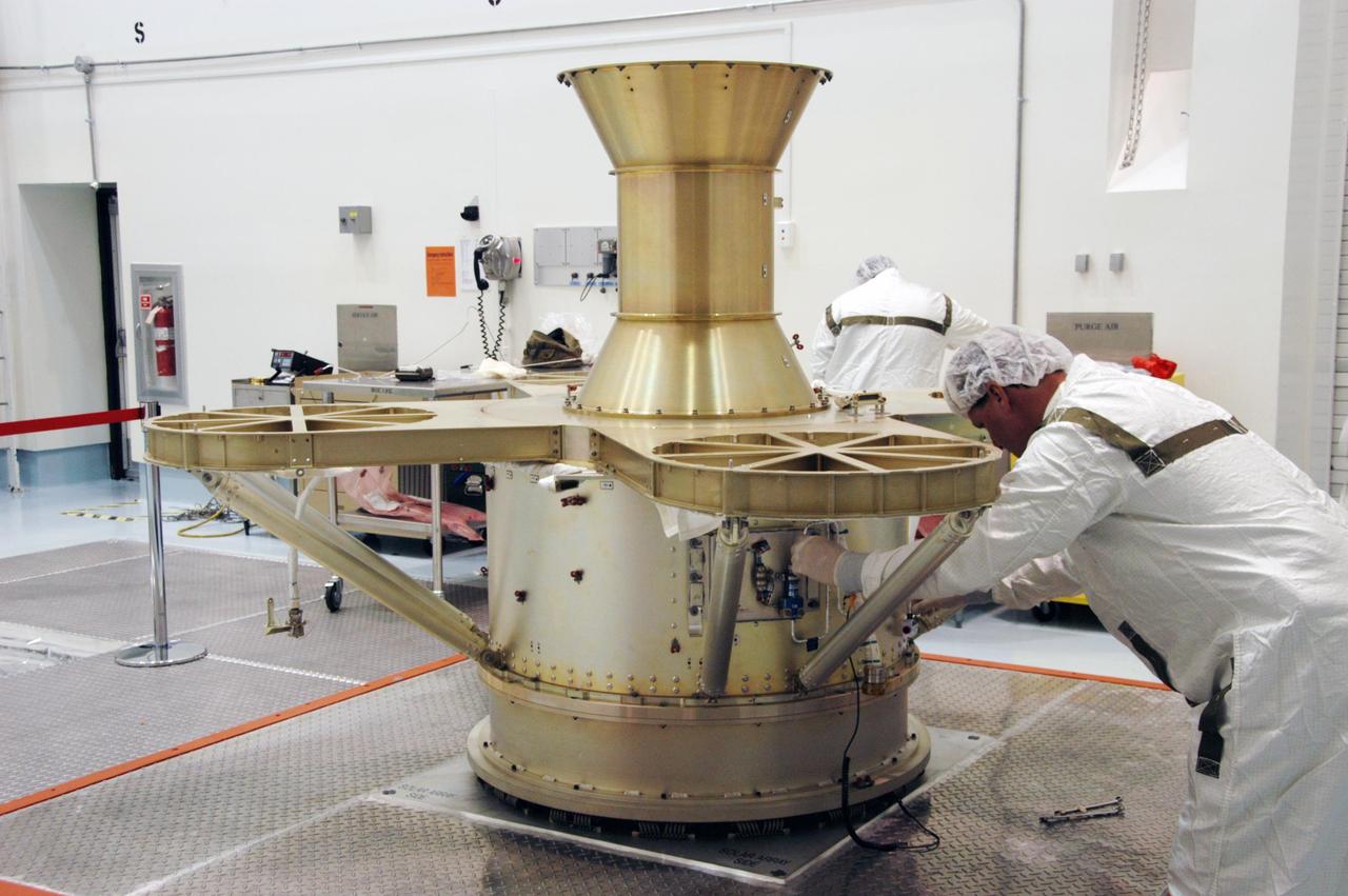 KENNEDY SPACE CENTER, FLA. -- At Astrotech Space Operations in Titusville, Fla., a worker attaches a high pressure line on the THEMIS spacecraft in preparation for fueling, which is scheduled for Jan. 3-5. THEMIS consists of five identical probes, the largest number of scientific satellites ever launched into orbit aboard a single rocket. This unique constellation of satellites will resolve the tantalizing mystery of what causes the spectacular sudden brightening of the aurora borealis and aurora australis - the fiery skies over the Earth's northern and southern polar regions. THEMIS is scheduled to launch Feb. 15 from Cape Canaveral Air Force Station. Photo credit: NASA/George Shelton