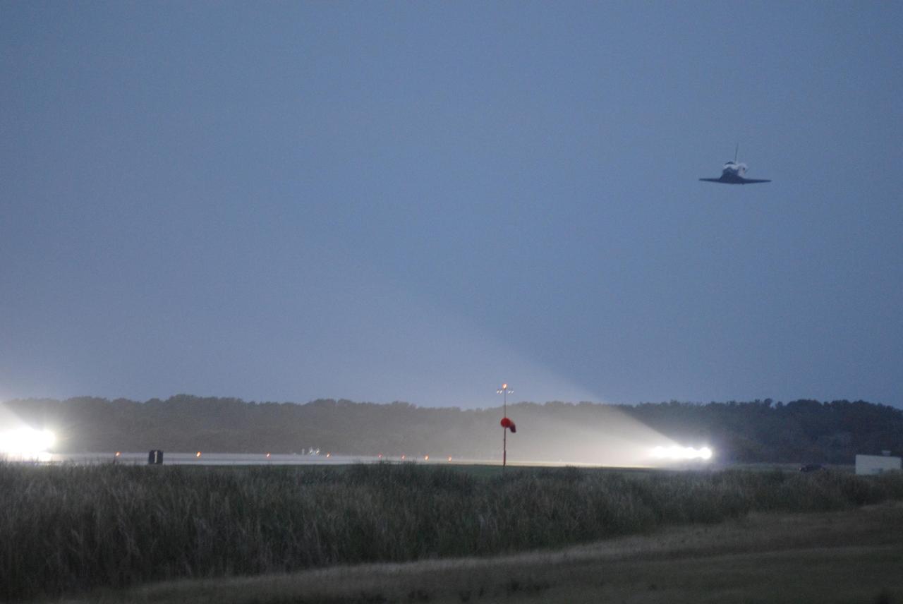 KENNEDY SPACE CENTER, FLA. -- On the shortest day of the year, Discovery approaches touchdown on Runway 15 at NASA Kennedy Space Center's Shuttle Landing Facility, concluding mission STS-116. Aboard are Commander Mark Polansky, Pilot William Oefelein, and Mission Specialists Robert Curbeam, Joan Higginbotham, Nicholas Patrick and Christer Fuglesang, who represents the European Space Agency, as well as Thomas Reiter, who is returning from a 6-month stay on the International Space Station. During the mission, three spacewalks attached the P5 integrated truss structure to the station, and completed the rewiring of the orbiting laboratory’s power system. A fourth spacewalk retracted a stubborn solar array. Main gear touchdown was at 5:32 p.m. EST. Nose gear touchdown was at 5:32:12 p.m. and wheel stop was at 5:32:52 p.m. At touchdown -- nominally about 2,500 ft. beyond the runway threshold -- the orbiter is traveling at a speed ranging from 213 to 226 mph. Discovery traveled 5,330,000 miles, landing on orbit 204. Mission elapsed time was 12 days, 20 hours, 44 minutes and 16 seconds. This is the 64th landing at KSC. Photo credit: NASA/Kim Shiflett