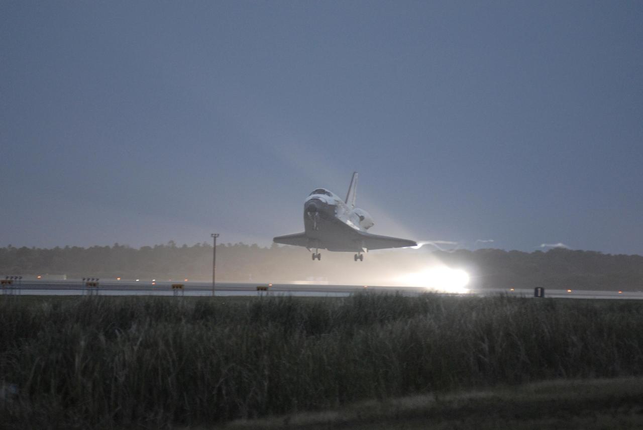 KENNEDY SPACE CENTER, FLA. -- On the shortest day of the year, Discovery touches down on Runway 15 at NASA Kennedy Space Center's Shuttle Landing Facility as the sun sets, concluding mission STS-116. Aboard are Commander Mark Polansky, Pilot William Oefelein, and Mission Specialists Robert Curbeam, Joan Higginbotham, Nicholas Patrick and Christer Fuglesang, who represents the European Space Agency, as well as Thomas Reiter, who is returning from a 6-month stay on the International Space Station. During the mission, three spacewalks attached the P5 integrated truss structure to the station, and completed the rewiring of the orbiting laboratory’s power system. A fourth spacewalk retracted a stubborn solar array. Main gear touchdown was at 5:32 p.m. EST. Nose gear touchdown was at 5:32:12 p.m. and wheel stop was at 5:32:52 p.m. At touchdown -- nominally about 2,500 ft. beyond the runway threshold -- the orbiter is traveling at a speed ranging from 213 to 226 mph. Discovery traveled 5,330,000 miles, landing on orbit 204. Mission elapsed time was 12 days, 20 hours, 44 minutes and 16 seconds. This is the 64th landing at KSC. Photo credit: NASA/Kim Shiflett
