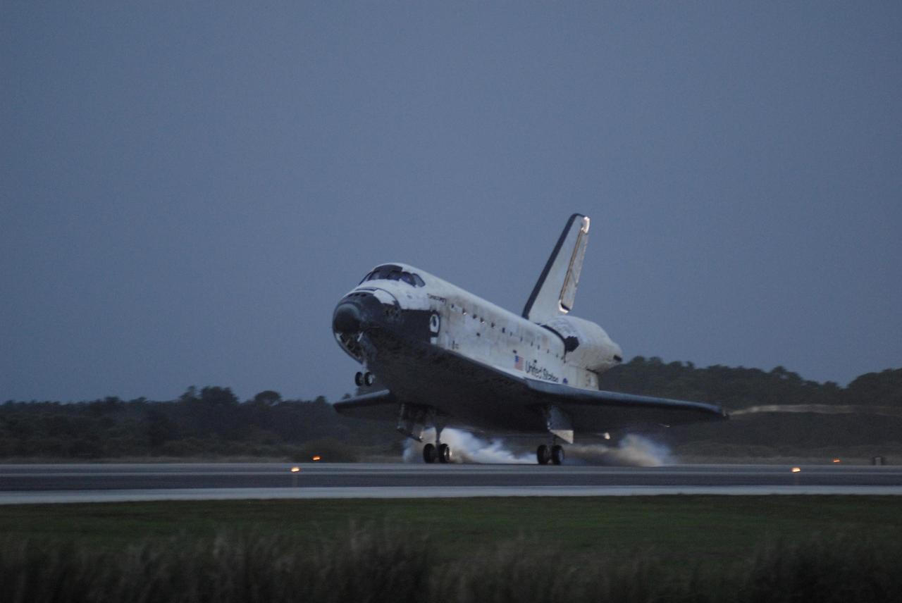KENNEDY SPACE CENTER, FLA. -- On the shortest day of the year, Discovery's main gear touch down on Runway 15 at NASA Kennedy Space Center's Shuttle Landing Facility as the sun sets, concluding mission STS-116. Aboard are Commander Mark Polansky, Pilot William Oefelein, and Mission Specialists Robert Curbeam, Joan Higginbotham, Nicholas Patrick and Christer Fuglesang, who represents the European Space Agency, as well as Thomas Reiter, who is returning from a 6-month stay on the International Space Station. During the mission, three spacewalks attached the P5 integrated truss structure to the station, and completed the rewiring of the orbiting laboratory’s power system. A fourth spacewalk retracted a stubborn solar array. Main gear touchdown was at 5:32 p.m. EST. Nose gear touchdown was at 5:32:12 p.m. and wheel stop was at 5:32:52 p.m. At touchdown -- nominally about 2,500 ft. beyond the runway threshold -- the orbiter is traveling at a speed ranging from 213 to 226 mph. Discovery traveled 5,330,000 miles, landing on orbit 204. Mission elapsed time was 12 days, 20 hours, 44 minutes and 16 seconds. This is the 64th landing at KSC. Photo credit: NASA/Kim Shiflett
