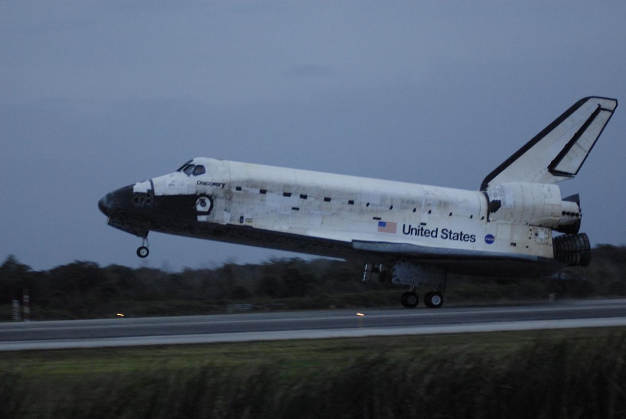 KENNEDY SPACE CENTER, FLA. -- On the shortest day of the year, Discovery's main gear touch down on Runway 15 at NASA Kennedy Space Center's Shuttle Landing Facility as the sun sets, concluding mission STS-116. Aboard are Commander Mark Polansky, Pilot William Oefelein, and Mission Specialists Robert Curbeam, Joan Higginbotham, Nicholas Patrick and Christer Fuglesang, who represents the European Space Agency, as well as Thomas Reiter, who is returning from a 6-month stay on the International Space Station. During the mission, three spacewalks attached the P5 integrated truss structure to the station, and completed the rewiring of the orbiting laboratory’s power system. A fourth spacewalk retracted a stubborn solar array. Main gear touchdown was at 5:32 p.m. EST. Nose gear touchdown was at 5:32:12 p.m. and wheel stop was at 5:32:52 p.m. At touchdown -- nominally about 2,500 ft. beyond the runway threshold -- the orbiter is traveling at a speed ranging from 213 to 226 mph. Discovery traveled 5,330,000 miles, landing on orbit 204. Mission elapsed time was 12 days, 20 hours, 44 minutes and 16 seconds. This is the 64th landing at KSC. Photo credit: NASA/Kim Shiflett