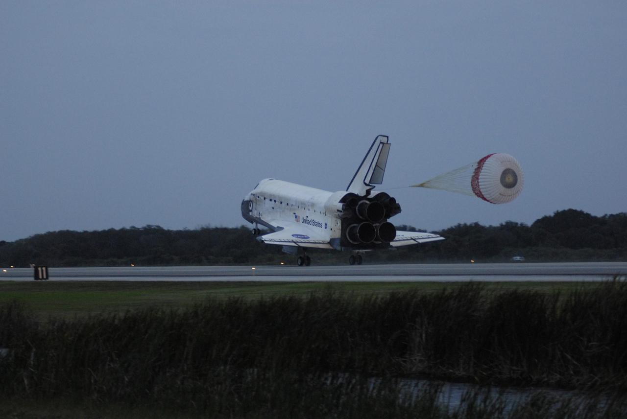 KENNEDY SPACE CENTER, FLA. -- Space Shuttle Discovery's drag chute unfurls upon landing on Runway 15 at NASA Kennedy Space Center's Shuttle Landing Facility as the sun sets on the shortest day of the year, concluding mission STS-116. Aboard are Commander Mark Polansky, Pilot William Oefelein, and Mission Specialists Robert Curbeam, Joan Higginbotham, Nicholas Patrick and Christer Fuglesang, who represents the European Space Agency, as well as Thomas Reiter, who is returning from a 6-month stay on the International Space Station. During the mission, three spacewalks attached the P5 integrated truss structure to the station, and completed the rewiring of the orbiting laboratory’s power system. A fourth spacewalk retracted a stubborn solar array. Main gear touchdown was at 5:32 p.m. EST. Nose gear touchdown was at 5:32:12 p.m. and wheel stop was at 5:32:52 p.m. At touchdown -- nominally about 2,500 ft. beyond the runway threshold -- the orbiter is traveling at a speed ranging from 213 to 226 mph. Discovery traveled 5,330,000 miles, landing on orbit 204. Mission elapsed time was 12 days, 20 hours, 44 minutes and 16 seconds. This is the 64th landing at KSC. Photo credit: NASA/Kim Shiflett
