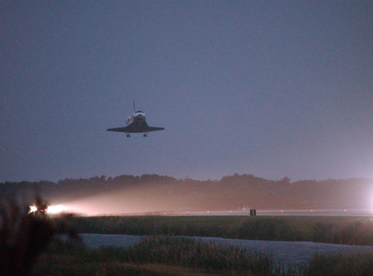 KENNEDY SPACE CENTER, FLA. -- Space Shuttle Discovery touches down on an illuminated Runway 15 at NASA Kennedy Space Center's Shuttle Landing Facility as the sun sets, concluding mission STS-116. Aboard are Commander Mark Polansky, Pilot William Oefelein, and Mission Specialists Robert Curbeam, Joan Higginbotham, Nicholas Patrick and Christer Fuglesang, who represents the European Space Agency, as well as Thomas Reiter, who is returning from a 6-month stay on the International Space Station. During the mission, three spacewalks attached the P5 integrated truss structure to the station, and completed the rewiring of the orbiting laboratory's power system. A fourth spacewalk retracted a stubborn solar array. Main gear touchdown was at 5:32 p.m. EST. Nose gear touchdown was at 5:32:12 p.m. and wheel stop was at 5:32:52 p.m. At touchdown -- nominally about 2,500 ft. beyond the runway threshold -- the orbiter is traveling at a speed ranging from 213 to 226 mph. Discovery traveled 5,330,000 miles, landing on orbit 204. Mission elapsed time was 12 days, 20 hours, 44 minutes and 16 seconds. This is the 64th landing at KSC. Photo credit: NASA/Mike Kerley