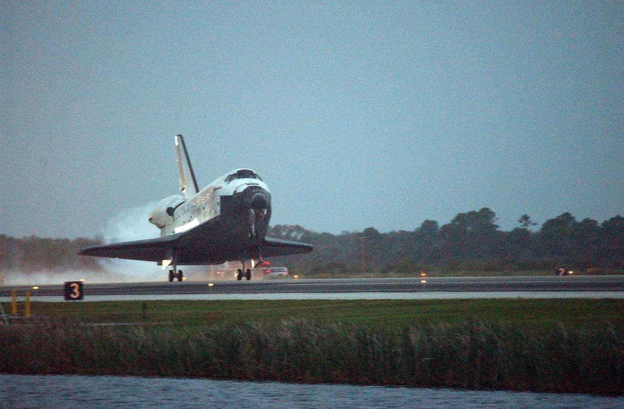KENNEDY SPACE CENTER, FLA. -- Space Shuttle Discovery nears touchdown on Runway 15 at NASA Kennedy Space Center's Shuttle Landing Facility as the sun sets on the shortest day of the year, concluding mission STS-116. Aboard are Commander Mark Polansky, Pilot William Oefelein, and Mission Specialists Robert Curbeam, Joan Higginbotham, Nicholas Patrick and Christer Fuglesang, who represents the European Space Agency, as well as Thomas Reiter, who is returning from a 6-month stay on the International Space Station. During the mission, three spacewalks attached the P5 integrated truss structure to the station, and completed the rewiring of the orbiting laboratory's power system. A fourth spacewalk retracted a stubborn solar array. Main gear touchdown was at 5:32 p.m. EST. Nose gear touchdown was at 5:32:12 p.m. and wheel stop was at 5:32:52 p.m. At touchdown -- nominally about 2,500 ft. beyond the runway threshold -- the orbiter is traveling at a speed ranging from 213 to 226 mph. Discovery traveled 5,330,000 miles, landing on orbit 204. Mission elapsed time was 12 days, 20 hours, 44 minutes and 16 seconds. This is the 64th landing at KSC. Photo credit: NASA/Mike Kerley