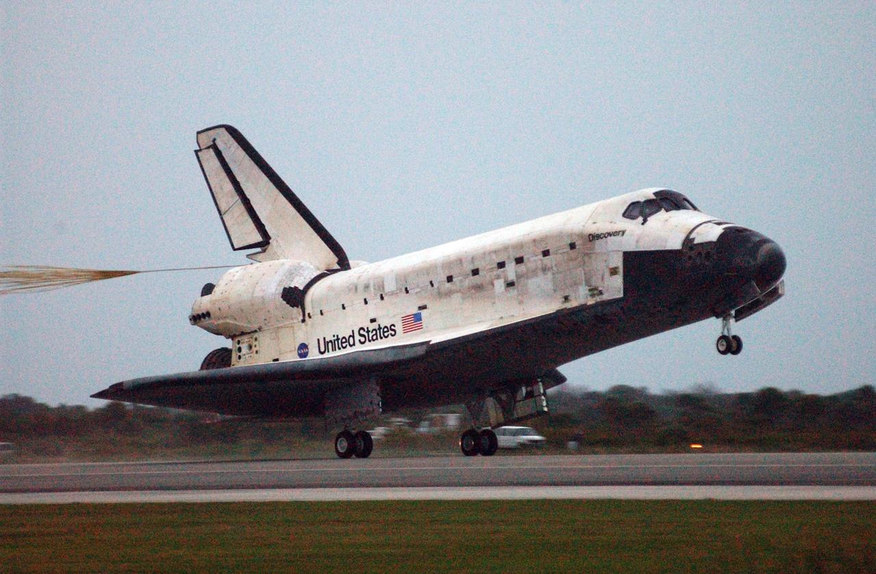 KENNEDY SPACE CENTER, FLA. -- Space Shuttle Discovery nears touchdown on Runway 15 at NASA Kennedy Space Center's Shuttle Landing Facility as the sun sets on the shortest day of the year, concluding mission STS-116. Aboard are Commander Mark Polansky, Pilot William Oefelein, and Mission Specialists Robert Curbeam, Joan Higginbotham, Nicholas Patrick and Christer Fuglesang, who represents the European Space Agency, as well as Thomas Reiter, who is returning from a 6-month stay on the International Space Station. During the mission, three spacewalks attached the P5 integrated truss structure to the station, and completed the rewiring of the orbiting laboratory's power system. A fourth spacewalk retracted a stubborn solar array. Main gear touchdown was at 5:32 p.m. EST. Nose gear touchdown was at 5:32:12 p.m. and wheel stop was at 5:32:52 p.m. At touchdown -- nominally about 2,500 ft. beyond the runway threshold -- the orbiter is traveling at a speed ranging from 213 to 226 mph. Discovery traveled 5,330,000 miles, landing on orbit 204. Mission elapsed time was 12 days, 20 hours, 44 minutes and 16 seconds. This is the 64th landing at KSC. Photo credit: NASA/Mike Kerley