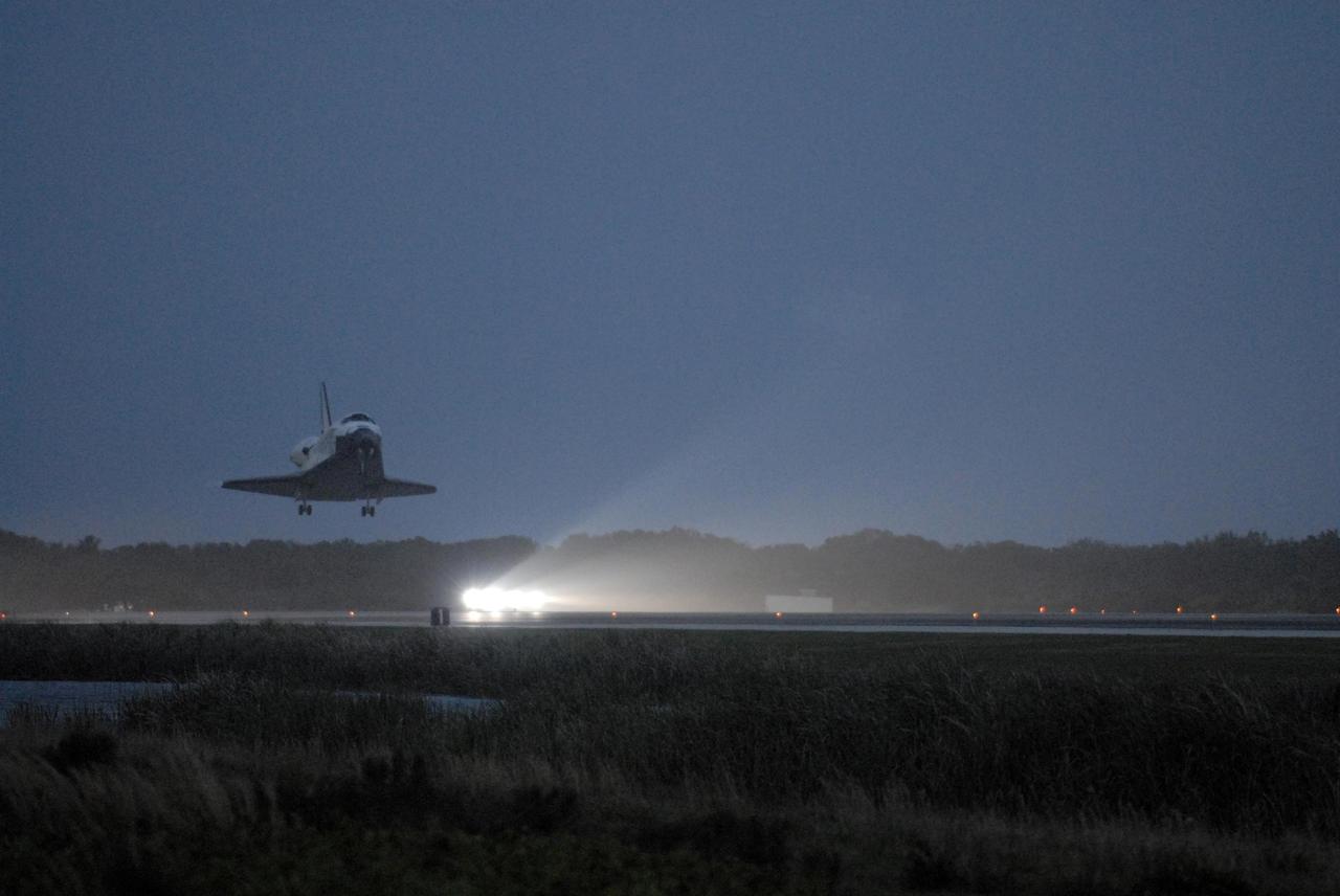KENNEDY SPACE CENTER, FLA. -- Space Shuttle Discovery touches down on an illuminated Runway 15 at NASA Kennedy Space Center's Shuttle Landing Facility as the sun sets, concluding mission STS-116. Aboard are Commander Mark Polansky, Pilot William Oefelein, and Mission Specialists Robert Curbeam, Joan Higginbotham, Nicholas Patrick and Christer Fuglesang, who represents the European Space Agency, as well as Thomas Reiter, who is returning from a 6-month stay on the International Space Station. During the mission, three spacewalks attached the P5 integrated truss structure to the station, and completed the rewiring of the orbiting laboratory's power system. A fourth spacewalk retracted a stubborn solar array. Main gear touchdown was at 5:32 p.m. EST. Nose gear touchdown was at 5:32:12 p.m. and wheel stop was at 5:32:52 p.m. At touchdown -- nominally about 2,500 ft. beyond the runway threshold -- the orbiter is traveling at a speed ranging from 213 to 226 mph. Discovery traveled 5,330,000 miles, landing on orbit 204. Mission elapsed time was 12 days, 20 hours, 44 minutes and 16 seconds. This is the 64th landing at KSC. Photo credit: NASA/Tom Joseph