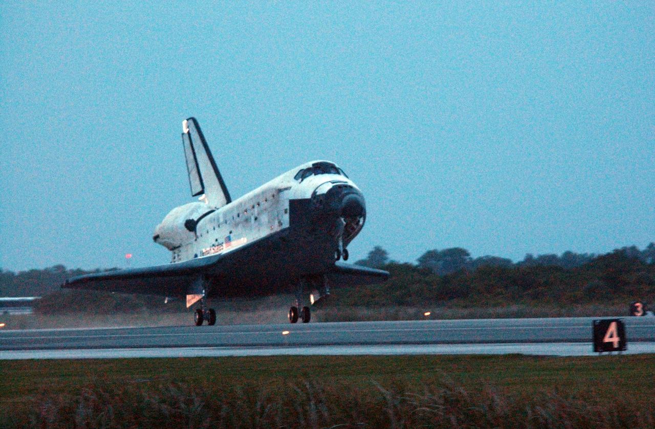 KENNEDY SPACE CENTER, FLA. -- On the shortest day of the year, Discovery's main gear touch down on Runway 15 at NASA Kennedy Space Center's Shuttle Landing Facility as the sun sets, concluding mission STS-116. Aboard are Commander Mark Polansky, Pilot William Oefelein, and Mission Specialists Robert Curbeam, Joan Higginbotham, Nicholas Patrick and Christer Fuglesang, who represents the European Space Agency, as well as Thomas Reiter, who is returning from a 6-month stay on the International Space Station. During the mission, three spacewalks attached the P5 integrated truss structure to the station, and completed the rewiring of the orbiting laboratory's power system. A fourth spacewalk retracted a stubborn solar array. Main gear touchdown was at 5:32 p.m. EST. Nose gear touchdown was at 5:32:12 p.m. and wheel stop was at 5:32:52 p.m. At touchdown -- nominally about 2,500 ft. beyond the runway threshold -- the orbiter is traveling at a speed ranging from 213 to 226 mph. Discovery traveled 5,330,000 miles, landing on orbit 204. Mission elapsed time was 12 days, 20 hours, 44 minutes and 16 seconds. This is the 64th landing at KSC. Photo credit: NASA/John Kechele