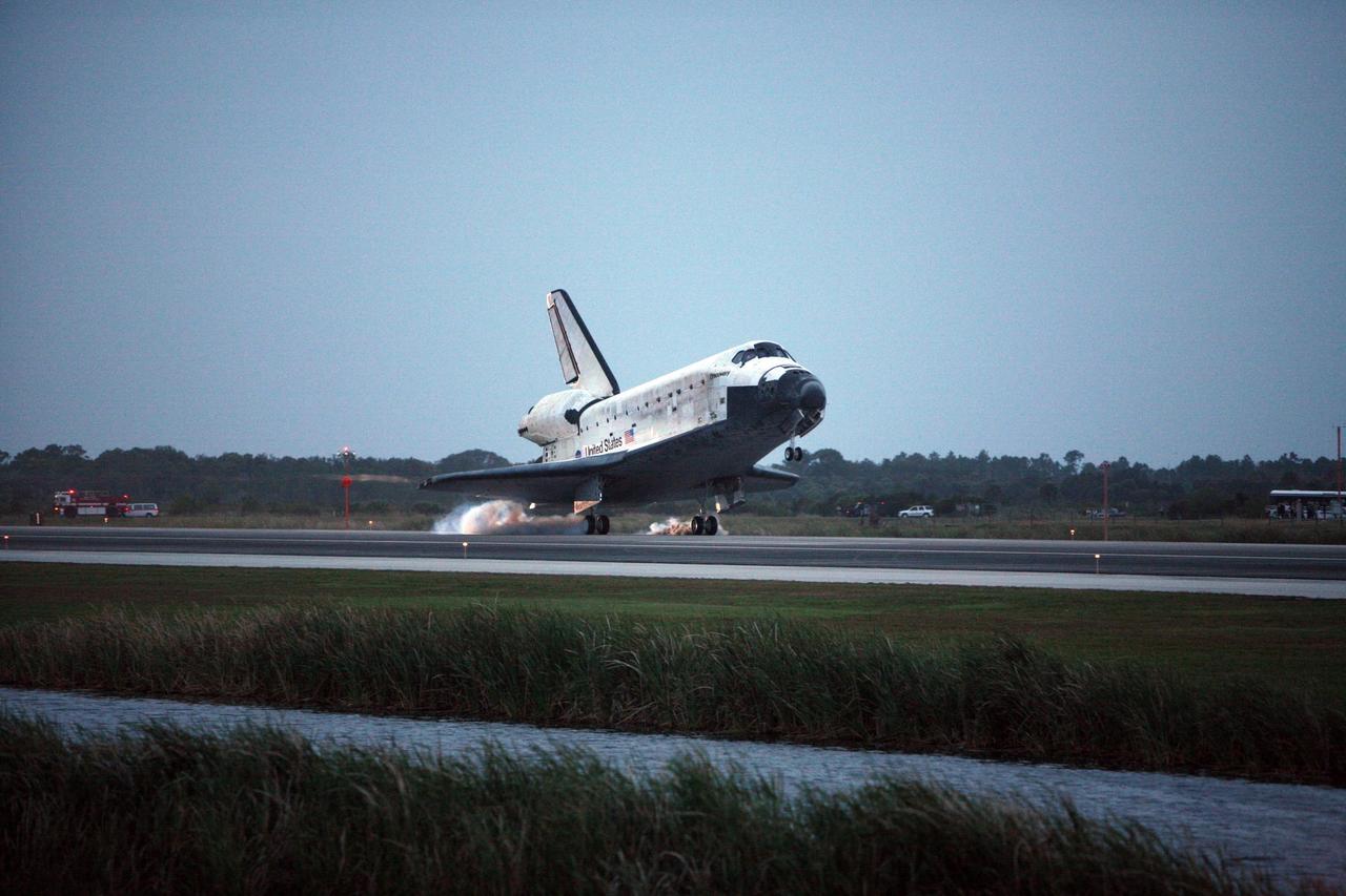 KENNEDY SPACE CENTER, FLA. -- On the shortest day of the year, Discovery's main gear touch down on Runway 15 at NASA Kennedy Space Center's Shuttle Landing Facility as the sun sets, concluding mission STS-116. Aboard are Commander Mark Polansky, Pilot William Oefelein, and Mission Specialists Robert Curbeam, Joan Higginbotham, Nicholas Patrick and Christer Fuglesang, who represents the European Space Agency, as well as Thomas Reiter, who is returning from a 6-month stay on the International Space Station. During the mission, three spacewalks attached the P5 integrated truss structure to the station, and completed the rewiring of the orbiting laboratory’s power system. A fourth spacewalk retracted a stubborn solar array. Main gear touchdown was at 5:32 p.m. EST. Nose gear touchdown was at 5:32:12 p.m. and wheel stop was at 5:32:52 p.m. At touchdown -- nominally about 2,500 ft. beyond the runway threshold -- the orbiter is traveling at a speed ranging from 213 to 226 mph. Discovery traveled 5,330,000 miles, landing on orbit 204. Mission elapsed time was 12 days, 20 hours, 44 minutes and 16 seconds. This is the 64th landing at KSC. Photo credit: NASA/Chris Lynch