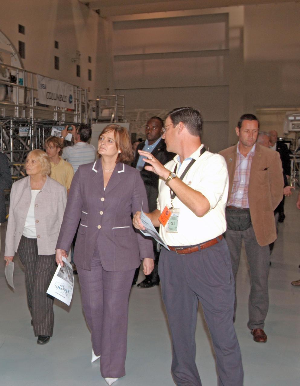 KENNEDY SPACE CENTER, FLA. --  Cherie Blair (center), wife of Tony Blair, prime minister of Great Britain, is given a guided walkthrough of the Space Station Processing Facility during a tour of Kennedy Space Center. From left in front are Gale Booth (Mrs. Blair's mother), Mrs. Blair and Tom Pentrack, deputy director of ISS and Spacecraft Processing. Mrs. Blair is an attorney (barrister) in England. She was Chancellor of Liverpool John Moores University from 1999-2006, and in July 2006 was awarded the honorary title of Emeritus Chancellor. She is also Governor of the London School of Economics and the Open University. She is a founding member of Matrix Chambers in London, from which she continues to practice as a barrister, which specializes in human rights law.  Photo credit: NASA/John Keckley