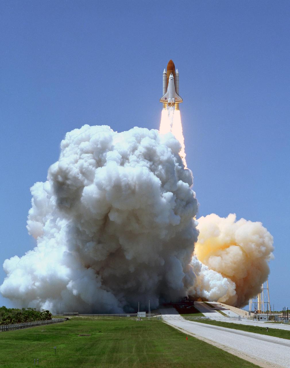 KENNEDY SPACE CENTER, FLA. -   Under clear blue skies, the launch of Space Shuttle Discovery on mission STS-121 kicks off the fireworks for the U.S. holiday in its third launch attempt in four days.  Liftoff from Launch Pad 39B was on-time at 2:38 p.m. EDT. During the 12-day mission, the STS-121 crew of seven will test new equipment and procedures to improve shuttle safety, as well as deliver supplies and make repairs to the International Space Station.  Landing is scheduled for July 16 or 17 at Kennedy's Shuttle Landing Facility. Photo credit: NASA/Sandy Joseph & Robert Murrary
