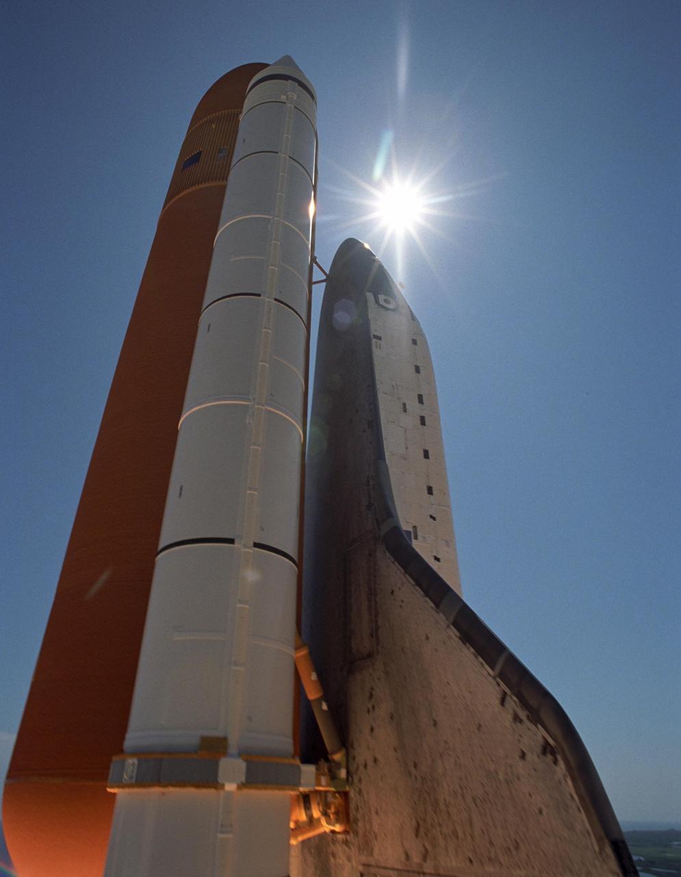 KENNEDY SPACE CENTER, FLA. - The sun radiates on Space Shuttle Atlantis as it heads for space on mission STS-115 to the International Space Station. Liftoff was on-time at 11:14:55 a.m. EDT. After several launch attempts were scrubbed due to weather and technical concerns, this launch was executed perfectly. Mission STS-115 is the 116th space shuttle flight, the 27th flight for orbiter Atlantis, and the 19th U.S. flight to the International Space Station. During the mission, Atlantis' astronauts will deliver and install the 17.5-ton, bus-sized P3/P4 integrated truss segment on the station. The girder-like truss includes a set of giant solar arrays, batteries and associated electronics and will provide one-fourth of the total power-generation capability for the completed station. STS-115 is scheduled to last 11 days with a planned landing at KSC.