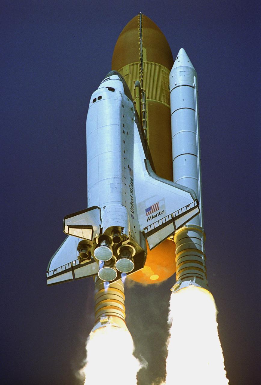KENNEDY SPACE CENTER, FLA. - Twin columns of fire propel Space Shuttle Atlantis into a clear blue sky after liftoff from Launch Pad 39B. Atlantis is heading for a rendezvous with the International Space Station on mission STS-115. Liftoff was on-time at 11:14:55 a.m. EDT. After several launch attempts were scrubbed due to weather and technical concerns, this launch was executed perfectly. Mission STS-115 is the 116th space shuttle flight, the 27th flight for orbiter Atlantis, and the 19th U.S. flight to the International Space Station. During the mission, Atlantis' astronauts will deliver and install the 17.5-ton, bus-sized P3/P4 integrated truss segment on the station. The girder-like truss includes a set of giant solar arrays, batteries and associated electronics and will provide one-fourth of the total power-generation capability for the completed station. STS-115 is scheduled to last 11 days with a planned landing at KSC