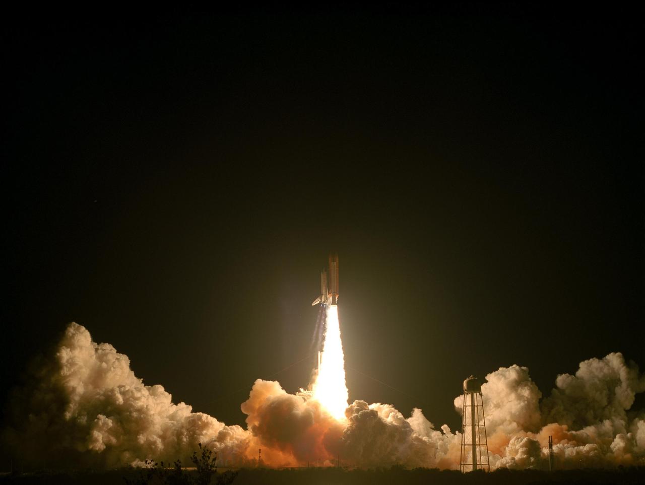 KENNEDY SPACE CENTER, FLA. --  Space Shuttle Discovery hurtles into the night sky trailing columns of fire from its solid rocket boosters as it launches on mission STS-116.  Liftoff occurred on time at 8:47 p.m. EST.  This was the second launch attempt for mission STS-116.  The first launch attempt on Dec. 7 was postponed due a low cloud ceiling over Kennedy Space Center. This is Discovery's 33rd mission and the first night launch since 2002.   The 20th shuttle mission to the International Space Station, STS-116 carries another truss segment, P5. It will serve as a spacer, mated to the P4 truss that was attached in September.  After installing the P5, the crew will reconfigure and redistribute the power generated by two pairs of U.S. solar arrays. Landing is expected Dec. 21 at KSC.   Photo credit: NASA/Sandy Joseph, Robert Murray & Chris Lynch