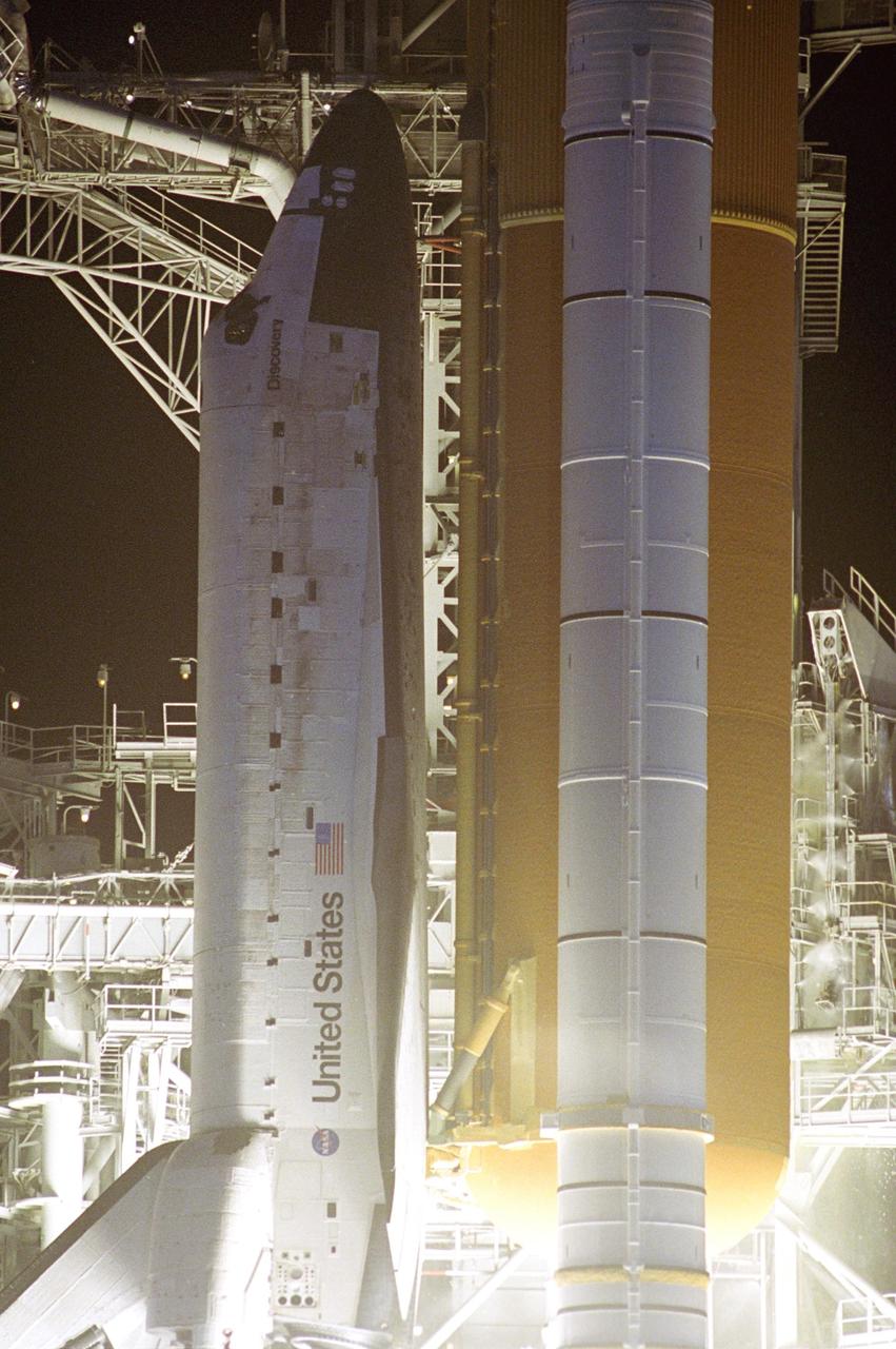 KENNEDY SPACE CENTER, FLA. --  A closeup of Space Shuttle Discovery at liftoff from Launch Pad 39B on mission STS-116.  Liftoff occurred on time at 8:47 p.m. EST.  This was the second launch attempt for mission STS-116.  The first launch attempt on Dec. 7 was postponed due a low cloud ceiling over Kennedy Space Center. This is Discovery's 33rd mission and the first night launch since 2002.   The 20th shuttle mission to the International Space Station, STS-116 carries another truss segment, P5. It will serve as a spacer, mated to the P4 truss that was attached in September.  After installing the P5, the crew will reconfigure and redistribute the power generated by two pairs of U.S. solar arrays. Landing is expected Dec. 21 at KSC.   Photo credit: NASA/Jerry Cannon & Mike Kerley