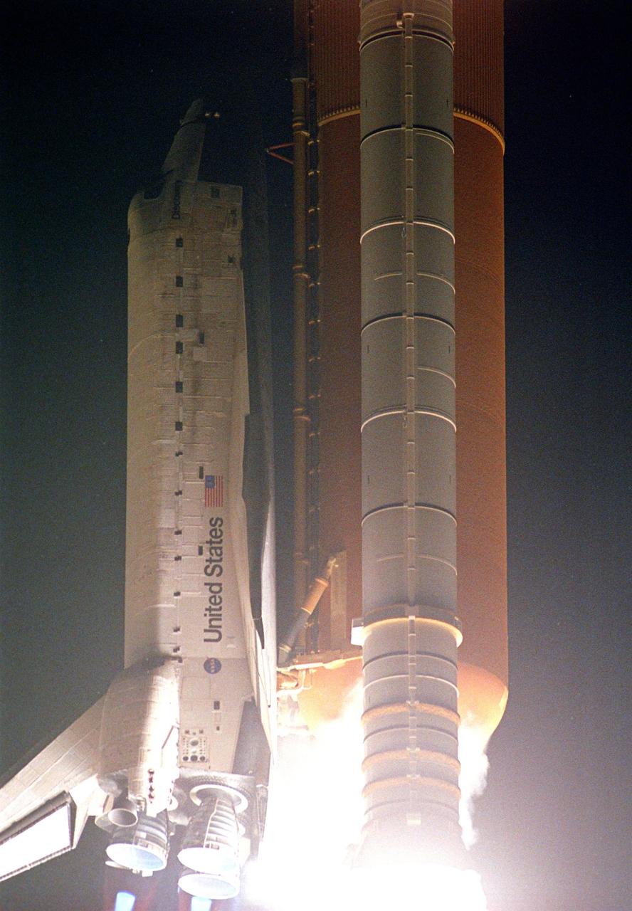 KENNEDY SPACE CENTER, FLA. --  Mach diamonds, below left, appear beneath Space Shuttle Discovery's main engines as the vehicle roars into the night sky after liftoff on mission STS-116. Mach diamonds are a formation of shock waves in the exhaust plume of an aerospace propulsion system.  Liftoff occurred on time at 8:47 p.m. EST.  This was the second launch attempt for mission STS-116.  The first launch attempt on Dec. 7 was postponed due a low cloud ceiling over Kennedy Space Center. This is Discovery's 33rd mission and the first night launch since 2002.   The 20th shuttle mission to the International Space Station, STS-116 carries another truss segment, P5. It will serve as a spacer, mated to the P4 truss that was attached in September.  After installing the P5, the crew will reconfigure and redistribute the power generated by two pairs of U.S. solar arrays. Landing is expected Dec. 21 at KSC.   Photo credit: NASA/Jerry Cannon & Mike Kerley