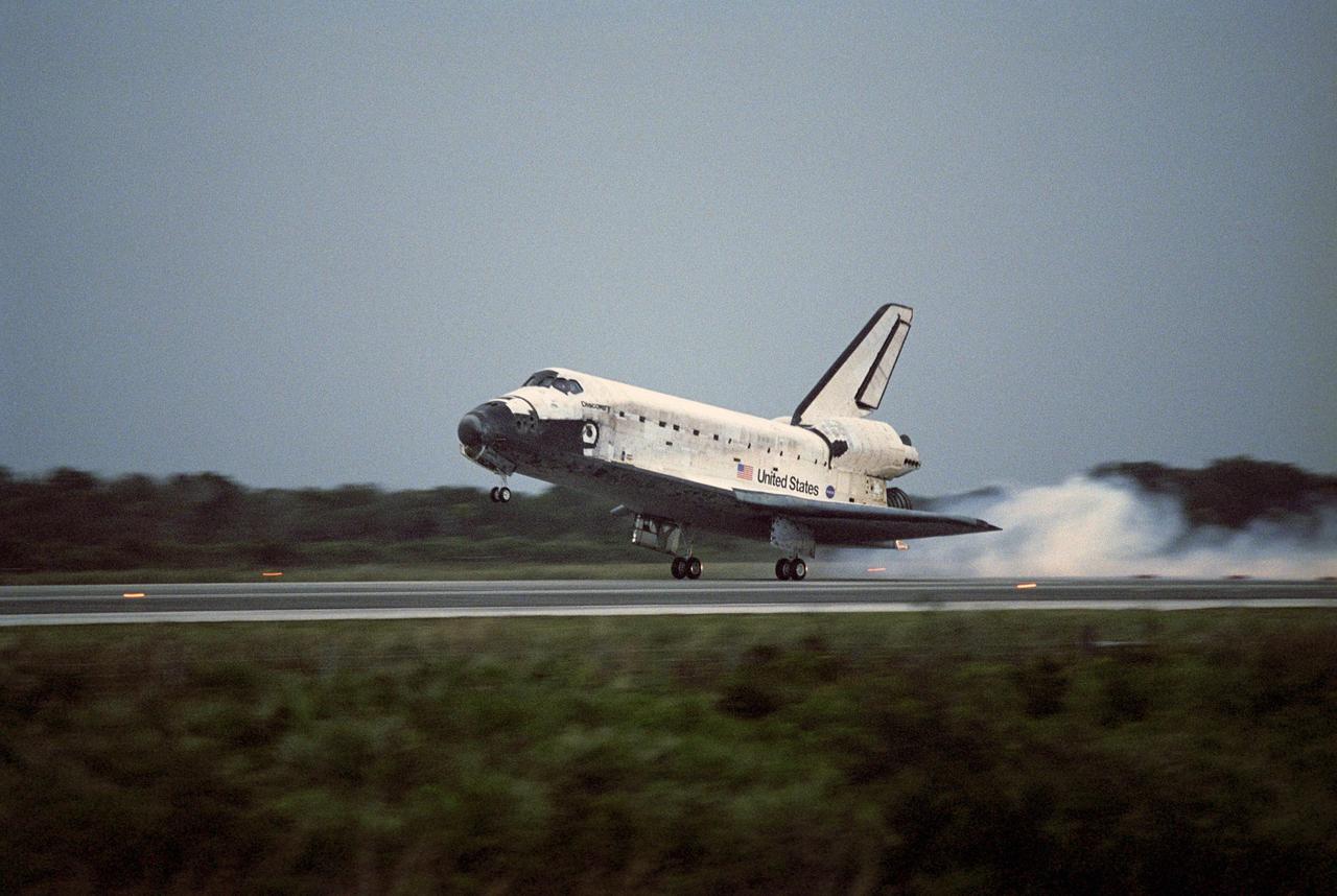 KENNEDY SPACE CENTER, FLA. -- Space Shuttle Discovery kicks up dust as it touches down on Runway 15 at NASA Kennedy Space Center's Shuttle Landing Facility, concluding mission STS-116. Main gear touchdown was at 5:32 p.m. EST. Nose gear touchdown was at 5:32:12 p.m. and wheel stop was at 5:32:52 p.m. At touchdown -- nominally about 2,500 ft. beyond the runway threshold -- the orbiter is traveling at a speed ranging from 213 to 226 mph. Discovery traveled 5,330,000 miles, landing on orbit 204. Mission elapsed time was 12 days, 20 hours, 44 minutes and 16 seconds. This is the 64th landing at KSC. Aboard Discovery are Commander Mark Polansky, Pilot William Oefelein, and Mission Specialists Robert Curbeam, Joan Higginbotham, Nicholas Patrick and Christer Fuglesang, who represents the European Space Agency, as well as Thomas Reiter, who is returning from a 6-month stay on the International Space Station. During the mission, three spacewalks attached the P5 integrated truss structure to the station, and completed the rewiring of the orbiting laboratory’s power system. A fourth spacewalk retracted a stubborn solar array.
