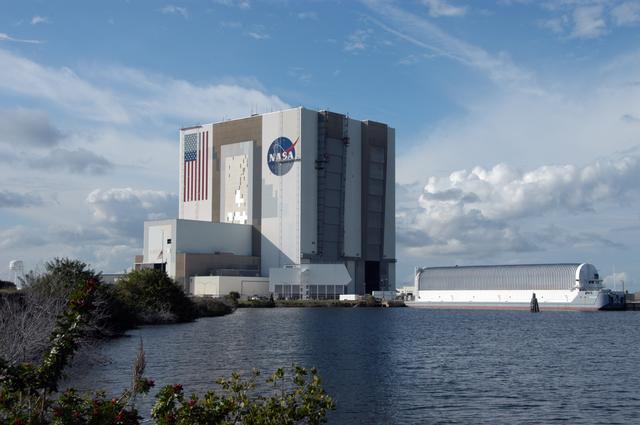 NASA image: Workers painting the Flag and Meatball on the VAB