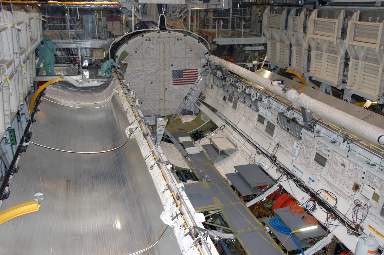 Endeavour's payload bay is open for payload configuration work in Orbiter Processing Facility bay 2. The orbiter is the vehicle designated for mission STS-118, scheduled to launch in late June. The mission will continue space station construction by delivering a third starboard truss segment, S5, as well as carrying the External Stowage Platform 3. The crew comprises six astronauts: Commander Scott Kelly, Pilot Charles Hobaugh and Mission Specialists Dr. Dafydd (Dave) Williams, Barbara Morgan, Richard Mastracchio and Tracy Caldwell. Williams represents the Canadian Space Agency.