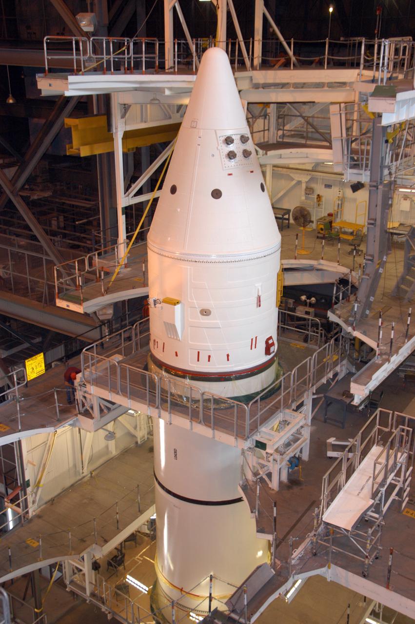 Workers continue stacking the solid rocket boosters in highbay 1 inside Kennedy Space Center's Vehicle Assembly Building. The solid rocket boosters are being prepared for NASA's next Space Shuttle launch, mission STS-117. The mission is scheduled to launch aboard Atlantis no earlier than March 16, 2007.