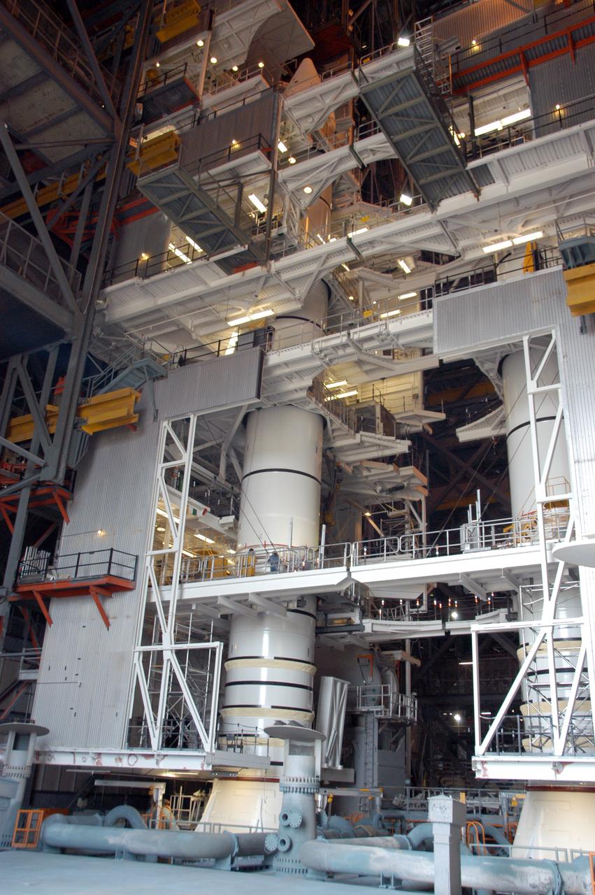 Workers continue stacking the twin solid rocket boosters in highbay 1 inside Kennedy Space Center's Vehicle Assembly Building. The solid rocket boosters are being prepared for NASA's next Space Shuttle launch, mission STS-117. The mission is scheduled to launch aboard Atlantis no earlier than March 16, 2007.