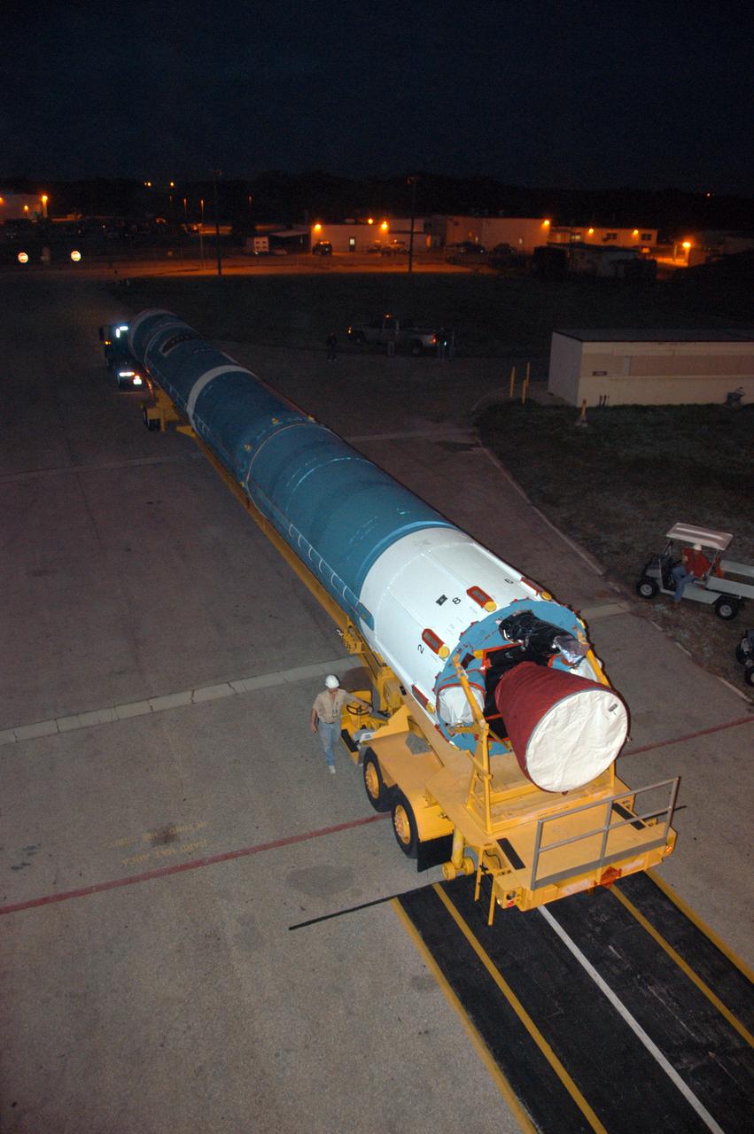The first stage of a United Launch Alliance Delta II rocket is on its way to Launch Pad 17-B on Cape Canaveral Air Force Station in Florida. The rocket is the launch vehicle for the THEMIS spacecraft, consisting of five identical probes, the largest number of scientific satellites ever launched into orbit aboard a single rocket. This unique constellation of satellites will resolve the tantalizing mystery of what causes the spectacular sudden brightening of the aurora borealis and aurora australis - the fiery skies over the Earth's northern and southern polar regions. After the first stage is in the mobile service tower on the pad, nine solid rocket boosters will be placed around the base of the first stage and attached in sets of three. THEMIS is scheduled to launch aboard the Delta II at 6:07 p.m. EST on Feb. 15.