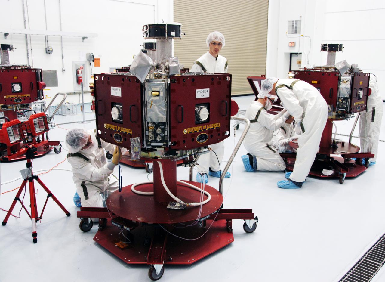 In the Hazardous Processing Facility at Astrotech Space Operations, technicians prepare THEMIS probes for solar array illumination telemetry tests. THEMIS consists of five identical probes, the largest number of scientific satellites ever launched into orbit aboard a single rocket. This unique constellation of satellites will resolve the tantalizing mystery of what causes the spectacular sudden brightening of the aurora borealis and aurora australis - the fiery skies over the Earth's northern and southern polar regions. THEMIS is scheduled to launch aboard the Delta II at 6:07 p.m. EST on Feb. 15.