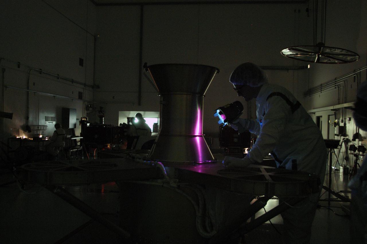At Astrotech Space Operations, technicians conduct black light inspection of the THEMIS probes. Black light inspection uses UVA fluorescence to detect possible particulate microcontamination, minute cracks or fluid leaks. THEMIS consists of five identical probes, the largest number of scientific satellites ever launched into orbit aboard a single rocket. This unique constellation of satellites will resolve the tantalizing mystery of what causes the spectacular sudden brightening of the aurora borealis and aurora australis - the fiery skies over the Earth's northern and southern polar regions. THEMIS is scheduled to launch Feb. 15 from Cape Canaveral Air Force Station. 