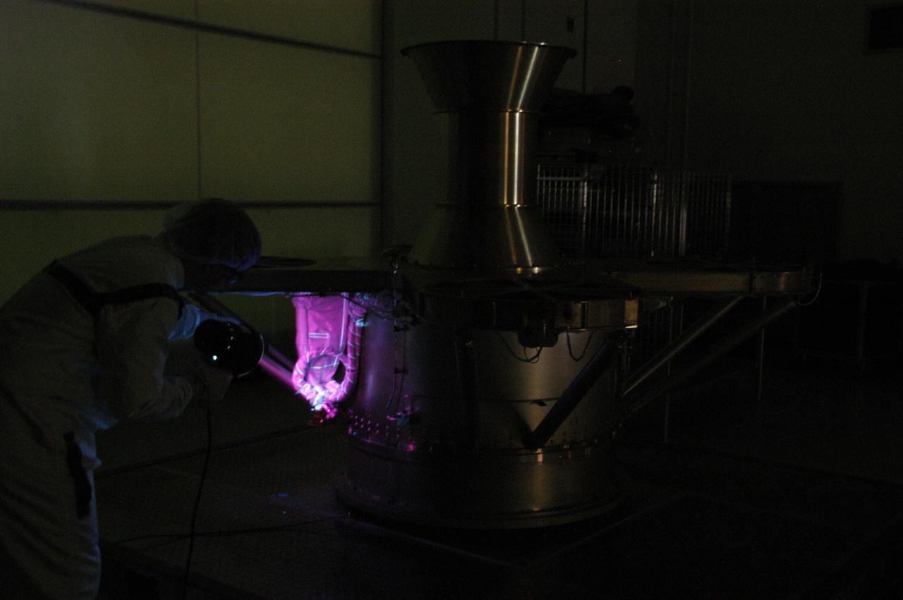 At Astrotech Space Operations, technicians conduct black light inspection of the THEMIS probes. Black light inspection uses UVA fluorescence to detect possible particulate microcontamination, minute cracks or fluid leaks. THEMIS consists of five identical probes, the largest number of scientific satellites ever launched into orbit aboard a single rocket. This unique constellation of satellites will resolve the tantalizing mystery of what causes the spectacular sudden brightening of the aurora borealis and aurora australis - the fiery skies over the Earth's northern and southern polar regions. THEMIS is scheduled to launch Feb. 15 from Cape Canaveral Air Force Station.