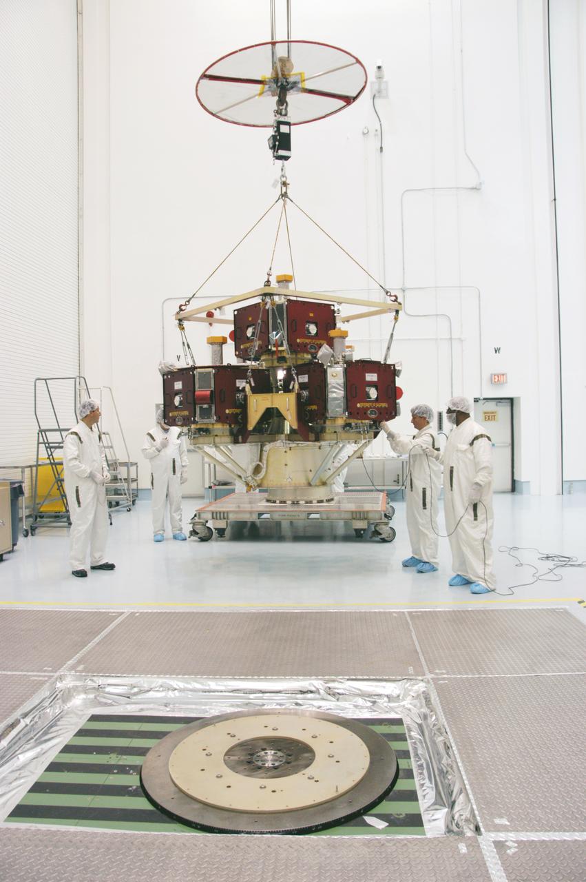 In the Hazardous Processing Facility at Astrotech Space Operations, workers get ready to move the integrated THEMIS spacecraft to the spin table in the foreground. There it will undergo spin-balance testing. THEMIS consists of five identical probes, the largest number of scientific satellites ever launched into orbit aboard a single rocket. This unique constellation of satellites will resolve the tantalizing mystery of what causes the spectacular sudden brightening of the aurora borealis and aurora australis - the fiery skies over the Earth's northern and southern polar regions. THEMIS is scheduled to launch Feb. 15 from Cape Canaveral Air Force Station. 
