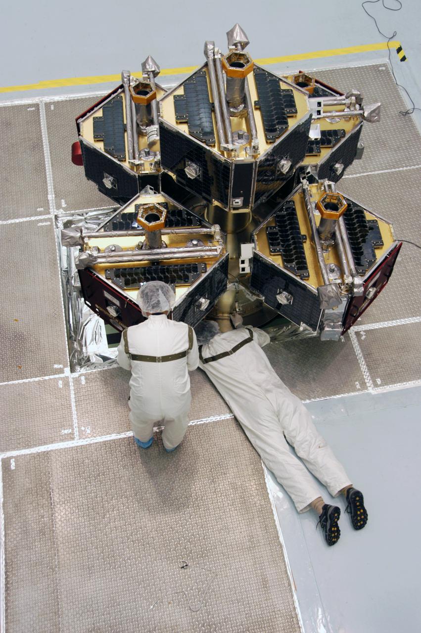 At Astrotech Space Operations, workers prepare the integrated THEMIS spacecraft for spin-balance testing. THEMIS consists of five identical probes, the largest number of scientific satellites ever launched into orbit aboard a single rocket. This unique constellation of satellites will resolve the tantalizing mystery of what causes the spectacular sudden brightening of the aurora borealis and aurora australis - the fiery skies over the Earth's northern and southern polar regions. THEMIS is scheduled to launch Feb. 15 from Cape Canaveral Air Force Station. 