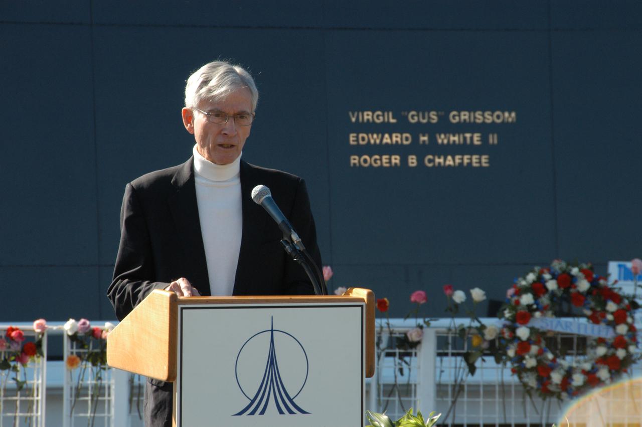 Former astronaut John Young addresses guests and attendees at a ceremony at the KSC Visitor Complex held in remembrance of the astronauts lost in the Apollo 1 fire: Virgil "Gus" Grissom, Edward H. White II and Roger B. Chaffee. Members of their families, along with Associate Administrator for Space Operations William Gerstenmaier, President of the Astronauts Memorial Foundation Stephen Feldman, Chairman of the Board of Directors of the Astronauts Memorial Foundation William Potter and former astronaut John Young, attended the ceremony. Behind the stage is the Space Mirror Memorial, designated as a national memorial by Congress and President George Bush in 1991 to honor fallen astronauts. Their names are emblazoned on the monument’s 42-1/2-foot-high by 50-foot-wide black granite surface as if to be projected into the heavens.