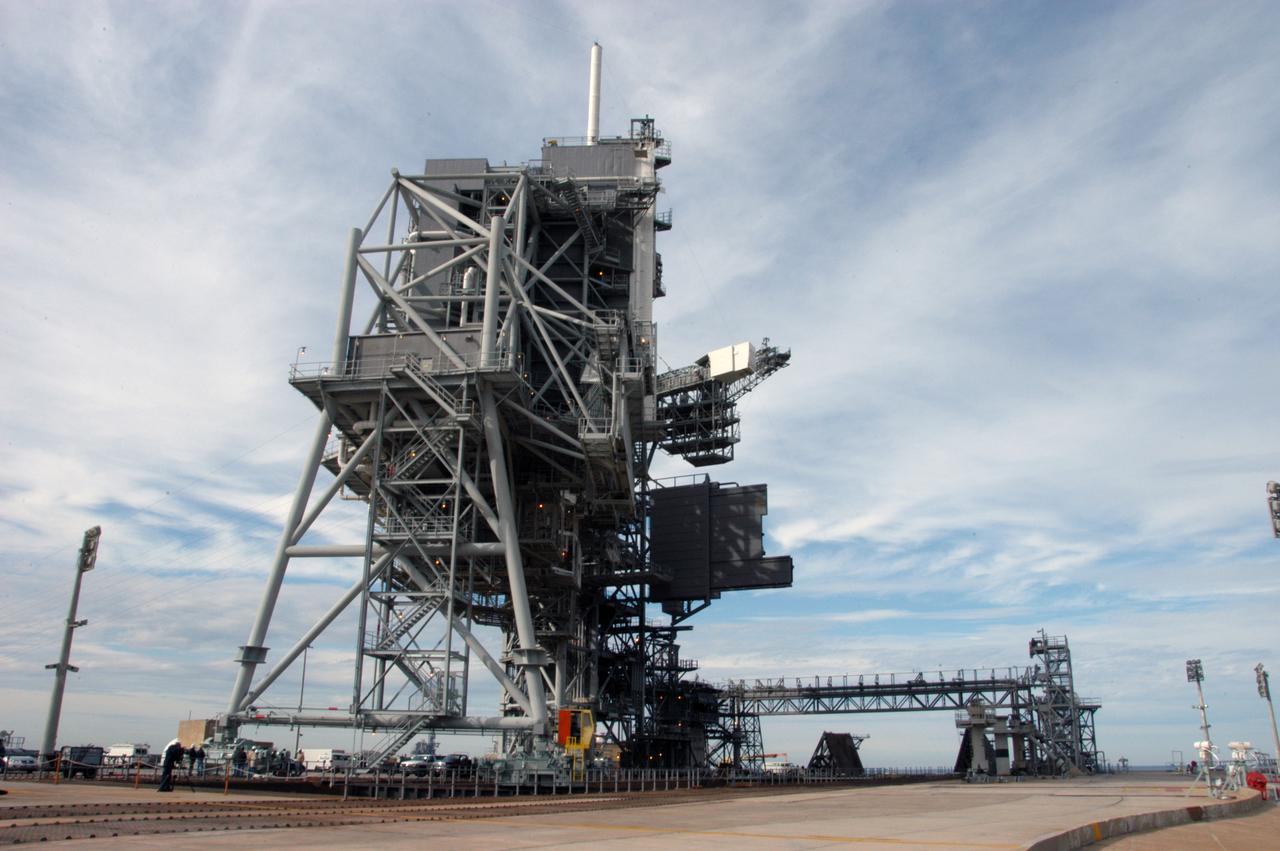 The rotating service structure on Launch Pad 39A is being moved for the first time in more than a year due to maintenance and upgrades on the pad. Some of the work included sandblasting the structure to remove rust and repainting. In addition, the RSS was jacked up and a new upper-bearing race assembly installed where the RSS pivots against the fixed service structure and a half-inch steel plate added. Pad 39A is being made ready for its first launch in four years, the upcoming STS-117 on March 15. 