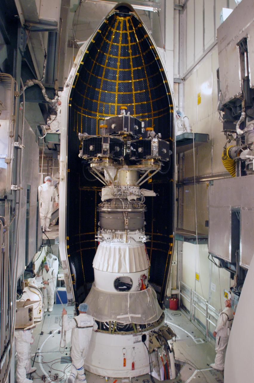 In the mobile service tower on Pad 17-B at Cape Canaveral Air Force Station, the first half of the fairing is moved into place around the THEMIS spacecraft. The fairing is a molded structure that fits flush with the outside surface of the Delta II upper stage booster and forms an aerodynamically smooth nose cone, protecting the spacecraft during launch and ascent. THEMIS is an acronym for Time History of Events and Macroscale Interactions during Substorms. THEMIS consists of five identical probes that will track violent, colorful eruptions near the North Pole. This will be the largest number of scientific satellites NASA ever launched into orbit aboard a single rocket. The THEMIS mission aims to unravel the tantalizing mystery behind auroral substorms, an avalanche of magnetic energy powered by the solar wind that intensifies the northern and southern lights. The mission will investigate what causes auroras in the Earth’s atmosphere to dramatically change from slowly shimmering waves of light to wildly shifting streaks of bright color. Launch of THEMIS is scheduled for Feb. 15 aboard a Delta II rocket, with the launch service being conducted by the United Launch Alliance.