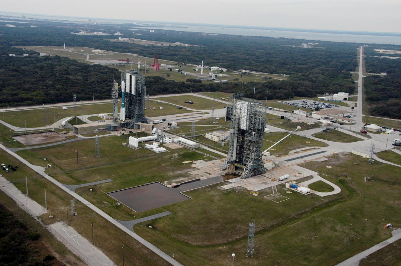 The Delta II rocket with the THEMIS spacecraft atop sits ready for launch on Pad 17-B at Cape Canaveral Air Force Station in this aerial view of the launch complex area as the mobile service tower begins to move away. THEMIS, an acronym for Time History of Events and Macroscale Interactions during Substorms, consists of five identical probes that will track violent, colorful eruptions near the North Pole. This will be the largest number of scientific satellites NASA has ever launched into orbit aboard a single rocket. The THEMIS mission aims to unravel the mystery behind auroral substorms, an avalanche of magnetic energy powered by the solar wind that intensifies the northern and southern lights. The mission will investigate what causes auroras in the Earth’s atmosphere to dramatically change from slowly shimmering waves of light to wildly shifting streaks of bright color. Launch is scheduled for 6:05 p.m.