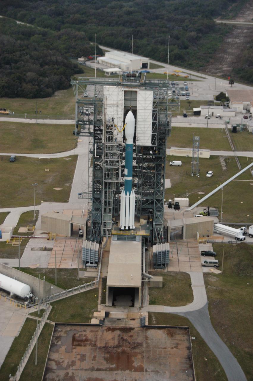 In this close-up aerial view, the Delta II rocket with the THEMIS spacecraft atop sits ready for launch on Pad 17-B at Cape Canaveral Air Force Station as the mobile service tower begins to move away. THEMIS, an acronym for Time History of Events and Macroscale Interactions during Substorms, consists of five identical probes that will track violent, colorful eruptions near the North Pole. This will be the largest number of scientific satellites NASA has ever launched into orbit aboard a single rocket. The THEMIS mission aims to unravel the mystery behind auroral substorms, an avalanche of magnetic energy powered by the solar wind that intensifies the northern and southern lights. The mission will investigate what causes auroras in the Earth’s atmosphere to dramatically change from slowly shimmering waves of light to wildly shifting streaks of bright color. Launch is scheduled for 6:05 p.m. 